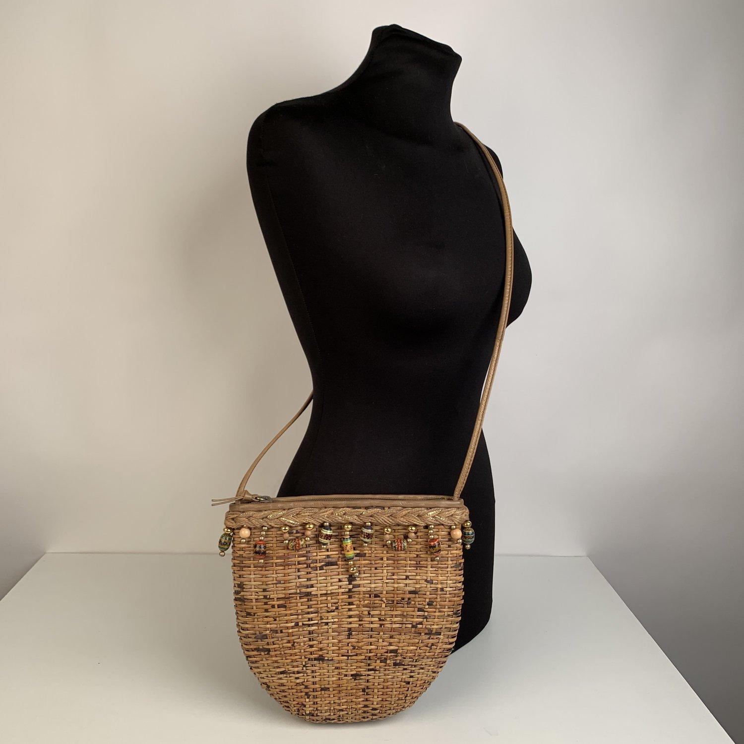 Small RODO crossbody bag crafted in straw emebellished with beads on the top. Upper zipper closure. Leather lining. 1 side open pocket inside. 'RODO' embossed inside, 'Italy' embossed inside. Details MATERIAL: Straw COLOR: Beige MODEL: Crossbody Bag