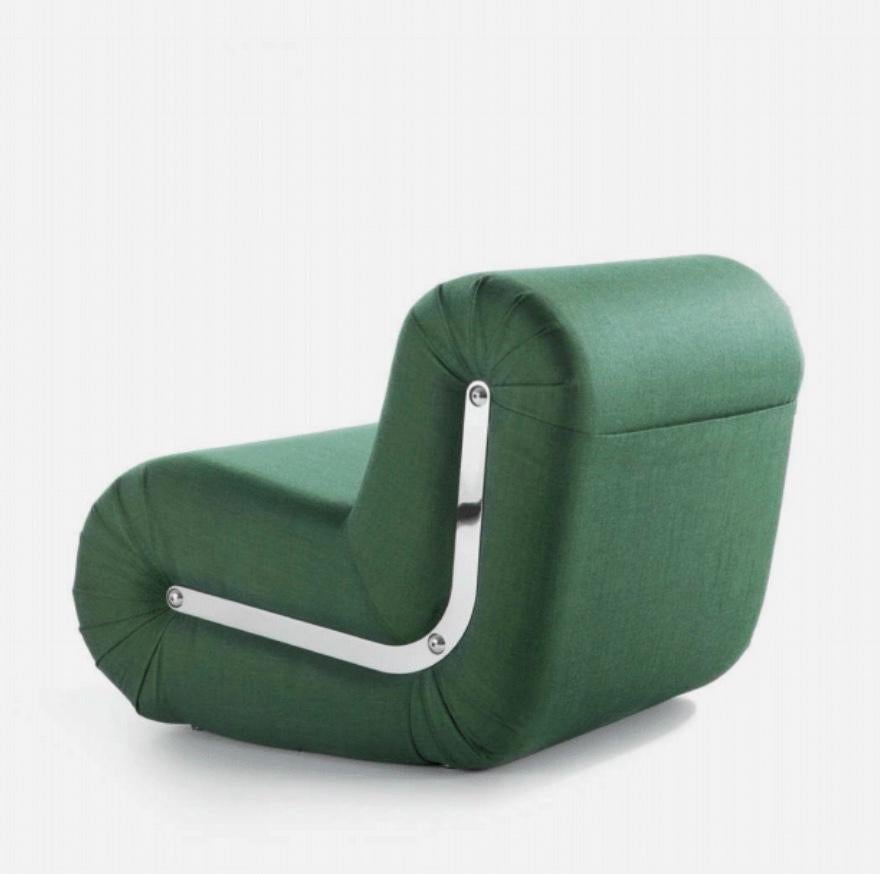 Rodolfo Bonetto ‘Boomerang’ lounge chair in Green 'Remix 3 by Kvadrat' 1968 for B-Line.

Boomerang is a welcoming lounge chair featuring a flat pocket at the back for use as magazine holder and is characterised by soft and essential lines. Its