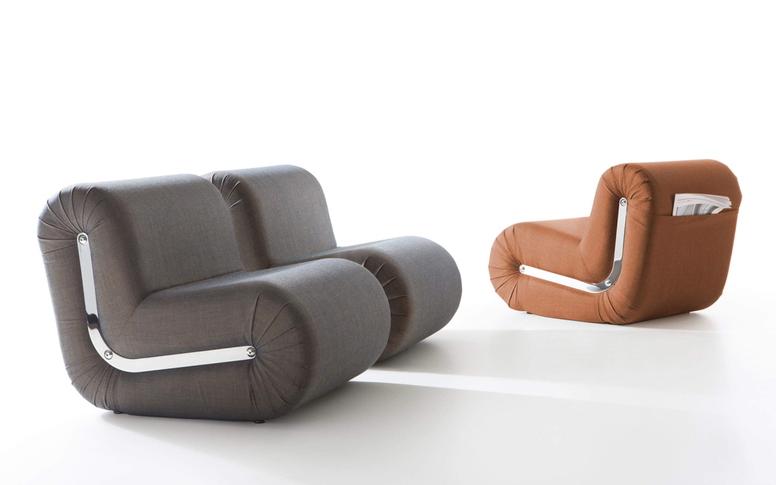 Rodolfo Bonetto set of 3 ‘Boomerang’ lounge chairs in 'Remix 3 by Kvadrat' 1968 for B-Line.

Boomerang is a welcoming lounge chair featuring a flat pocket at the back for use as magazine holder and is characterised by soft and essential lines. Its