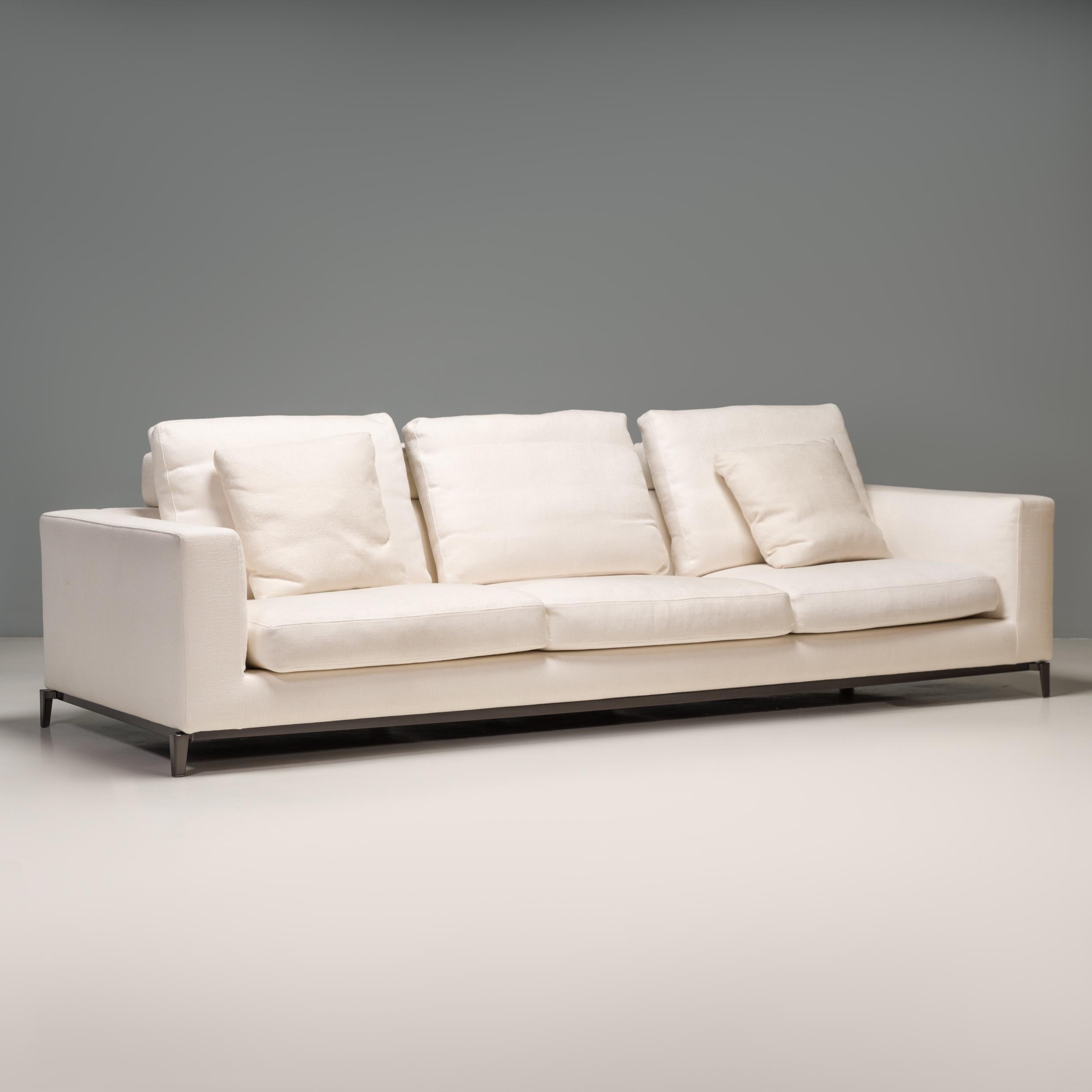 Designed by Rodolfo Dordoni for Minotti, the Andersen sofa formed part of the 2010 Senza Tempo Collection and embodies timeless Italian design.

Fully upholstered in white fabric, the sofa has a modern tuxedo style silhouette with the integrated