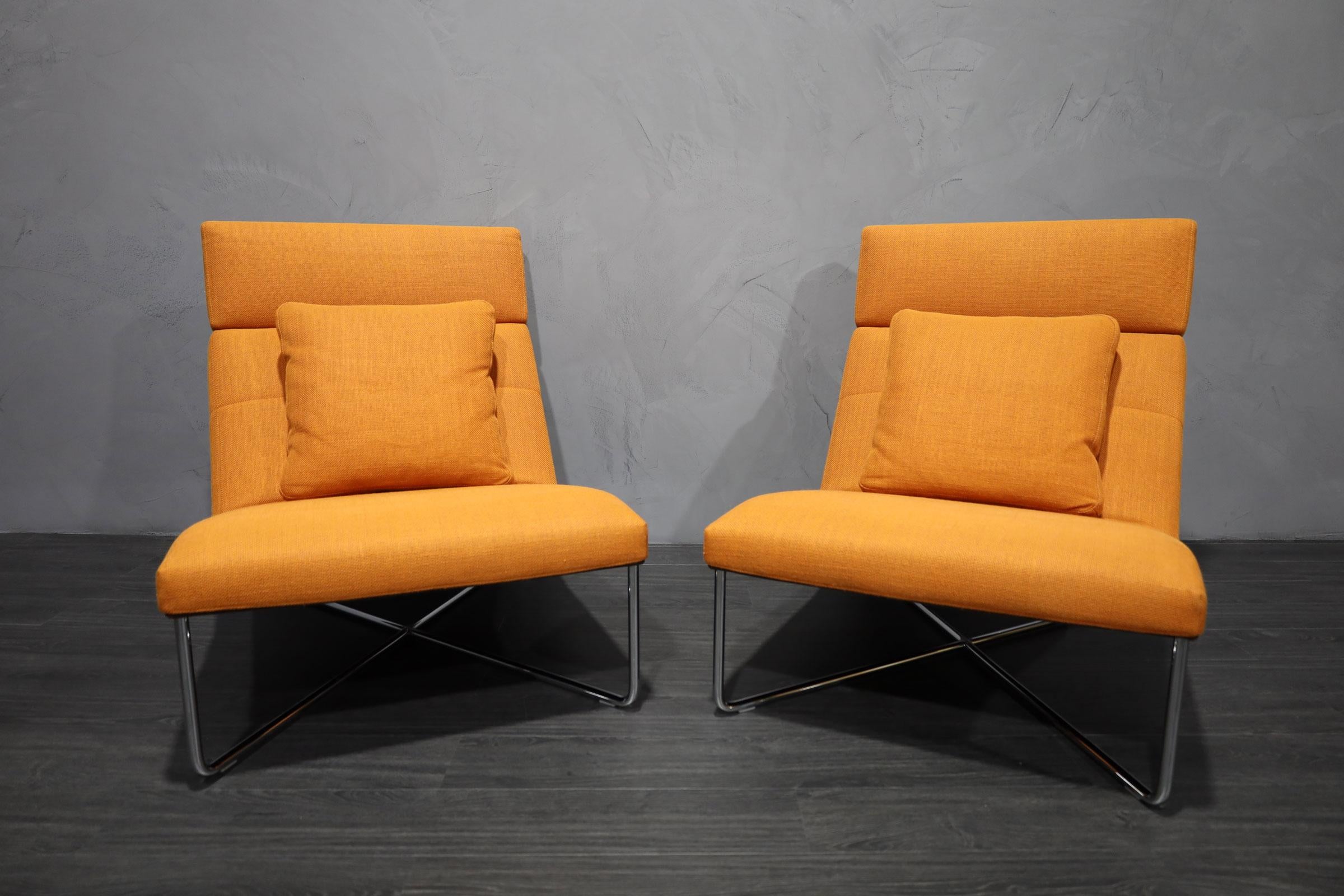 These are like new! Great looking pair of lounge chairs designed by Rodolfo Dordoni for Minotti. The backs are high so your head rest very comfortably.