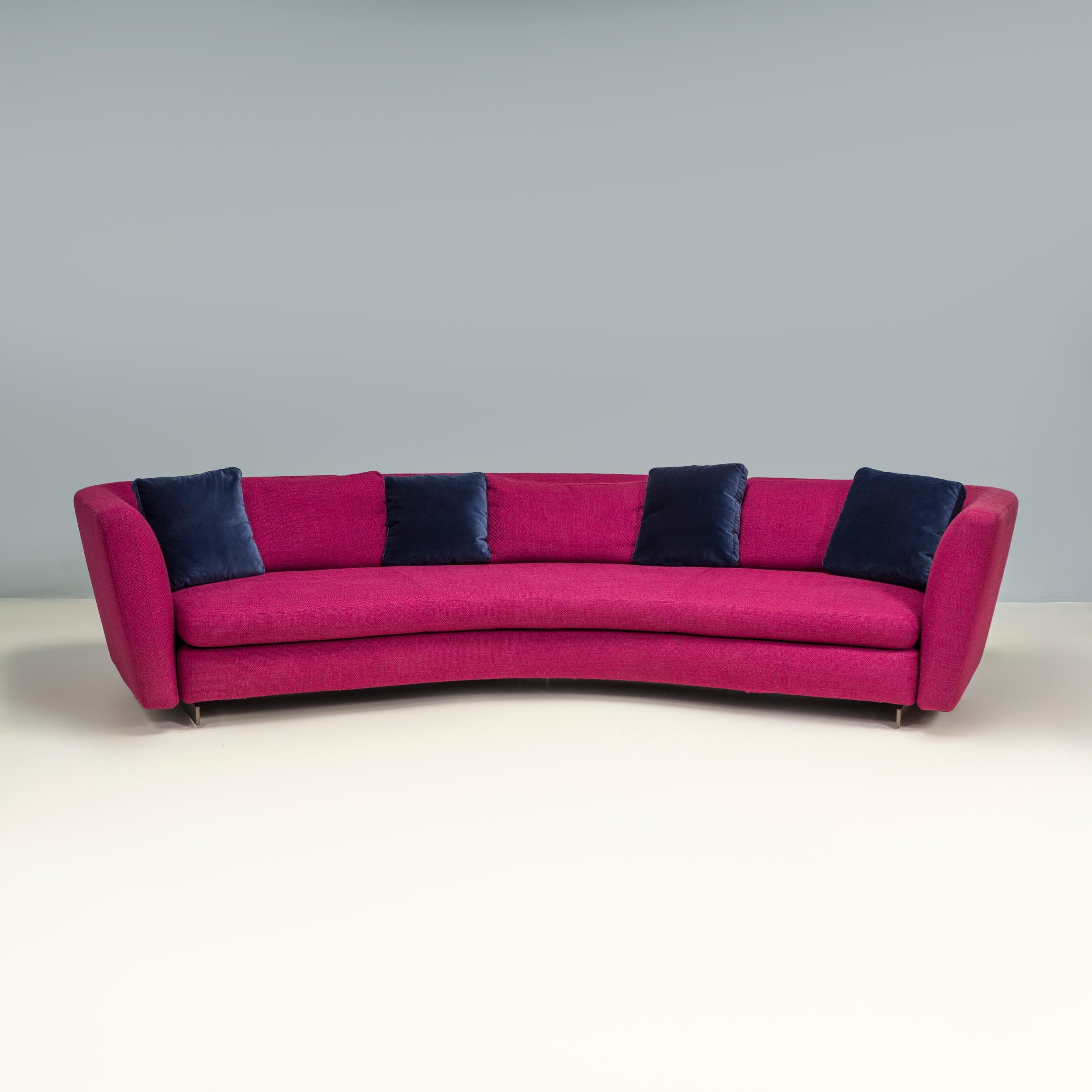 Originally designed by Roldolfo Dordoni in 2015 and manufactured by Minotti, the Seymour semi round low sofa is a fantastic example of modern Italian design. 

With a curvaceous silhouette, the sofa has a semi-circular seat with a curved tuxedo