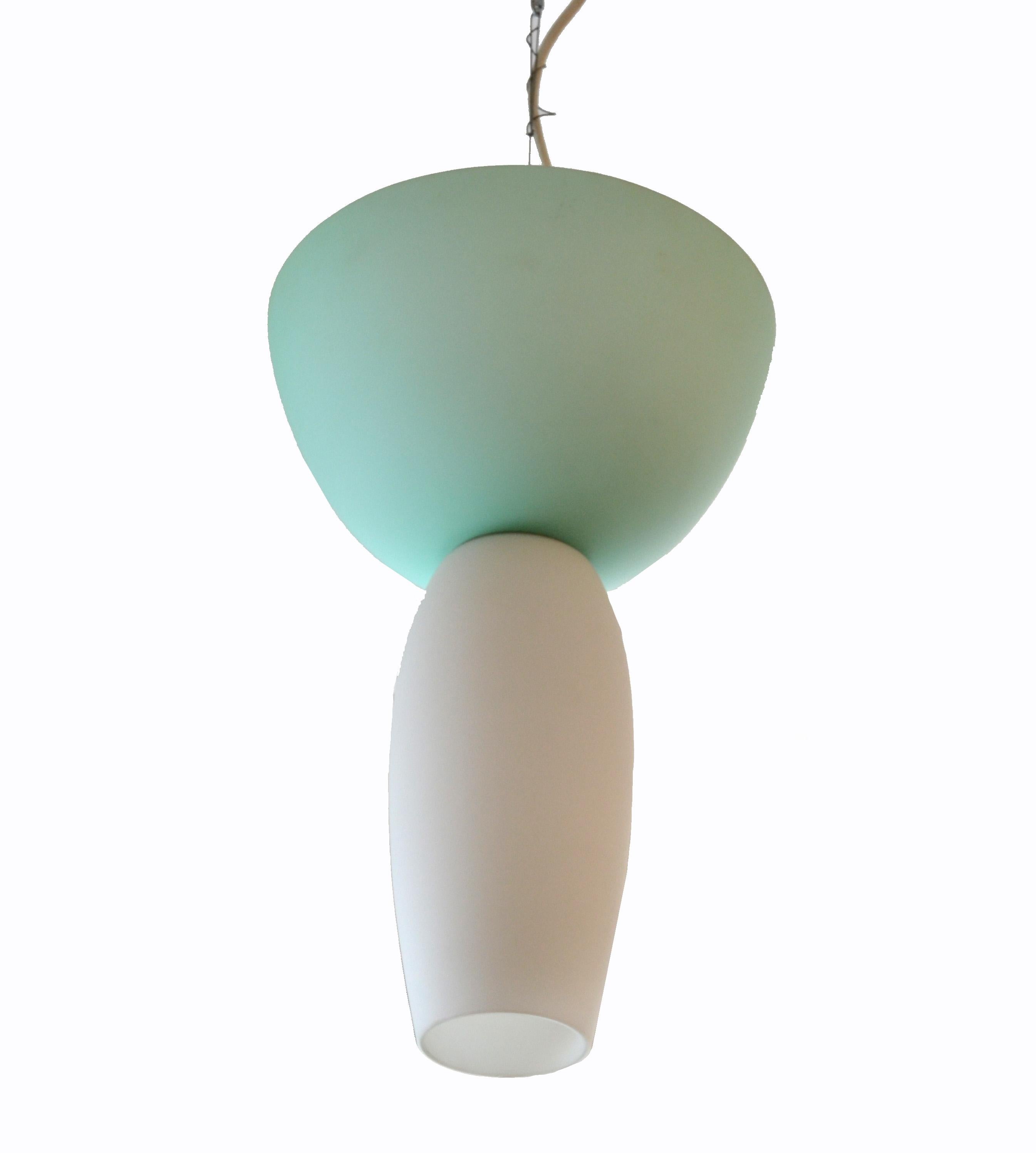 Rodolfo Dordoni Musa Murano pendant light for Artemide, Italy .
Handcrafted white and green Murano glass elements from 1994.
The top socket takes 3 light bulbs and the bottom socket 1 light bulb.
It is in perfect working condition and wired for