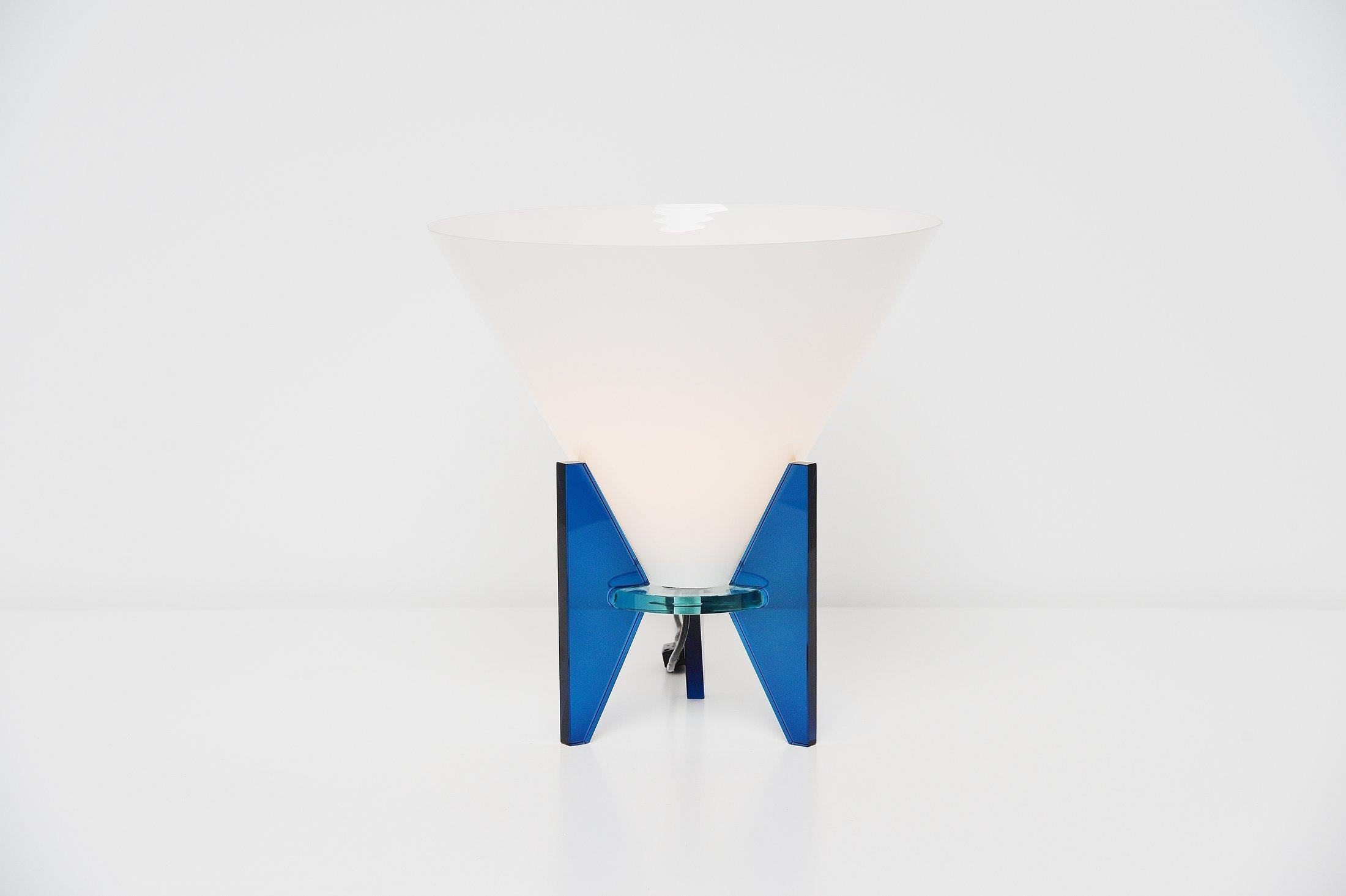 Very nice Postmodern 'Otero' table lamp designed by Rodolfo Dordoni and manufactured by Fontana Arte, Italy, 1986. The lamp is made of several different glass parts, in blue, transparent and milk colored glass. The lamp has a nice conical shape