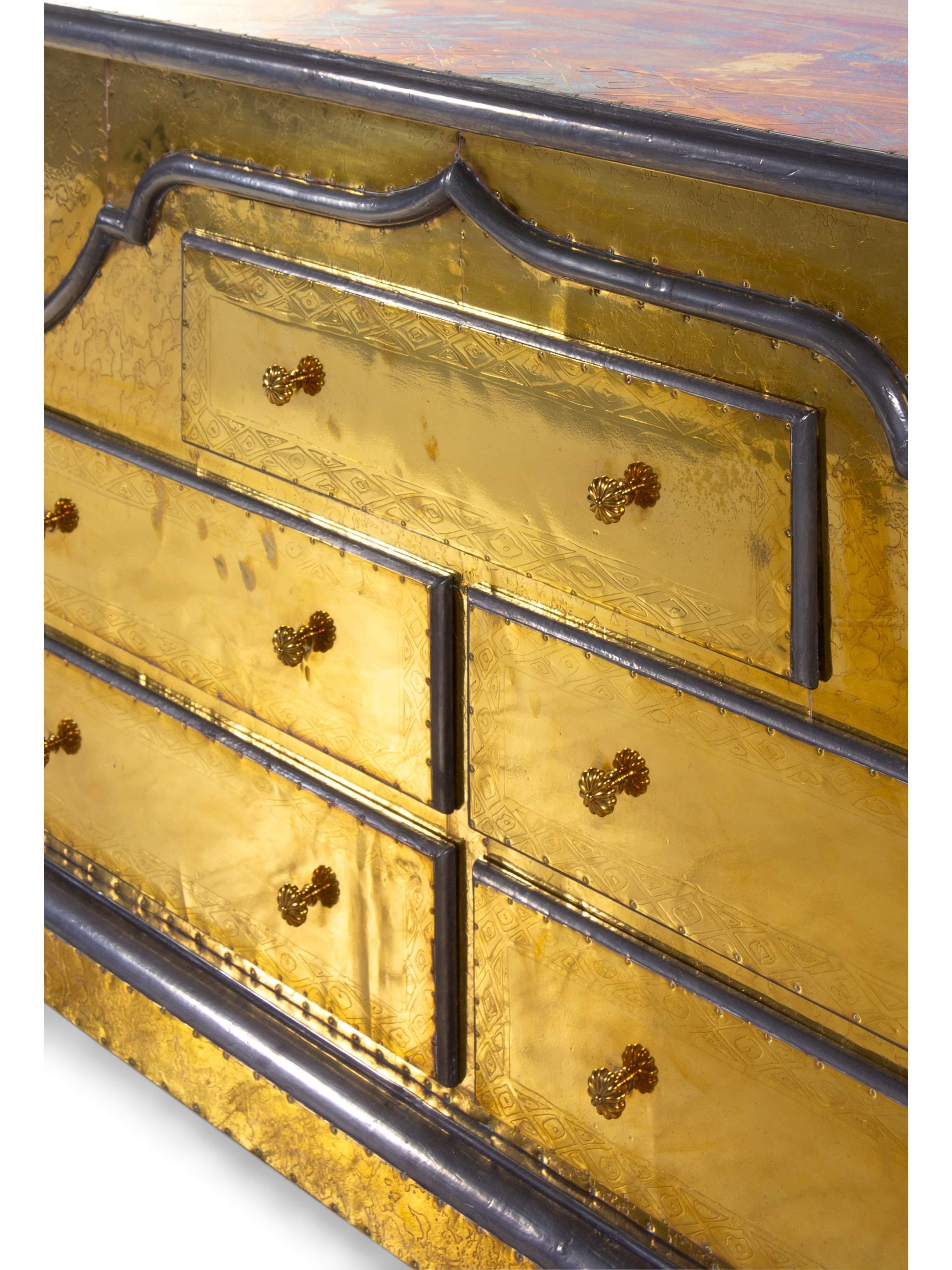 Rodolfo Dubarry handmade Spanish Regency dresser chest, gilt brass, pewter, early 1970s, Spain. Hand-tooled and gilt brass with pewter accents on wood. Gorgeous piece with stunning patina. Measures: H 32 x W 57 x D 20 inches.
 
