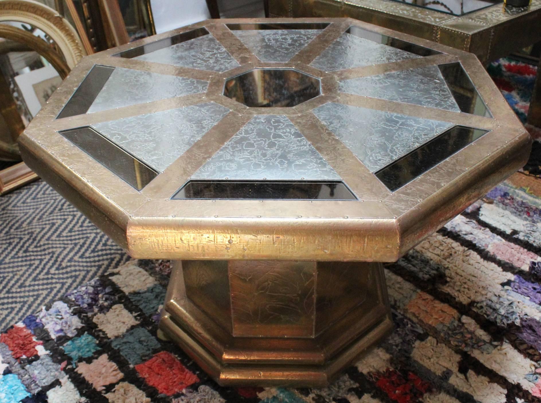 Rodolfo Dubarry’s 1970s Spanish gilded octagonal coffee table with mirrors made up of hand worked stamped golden and silvered brass panels and smoked mirrors.
 