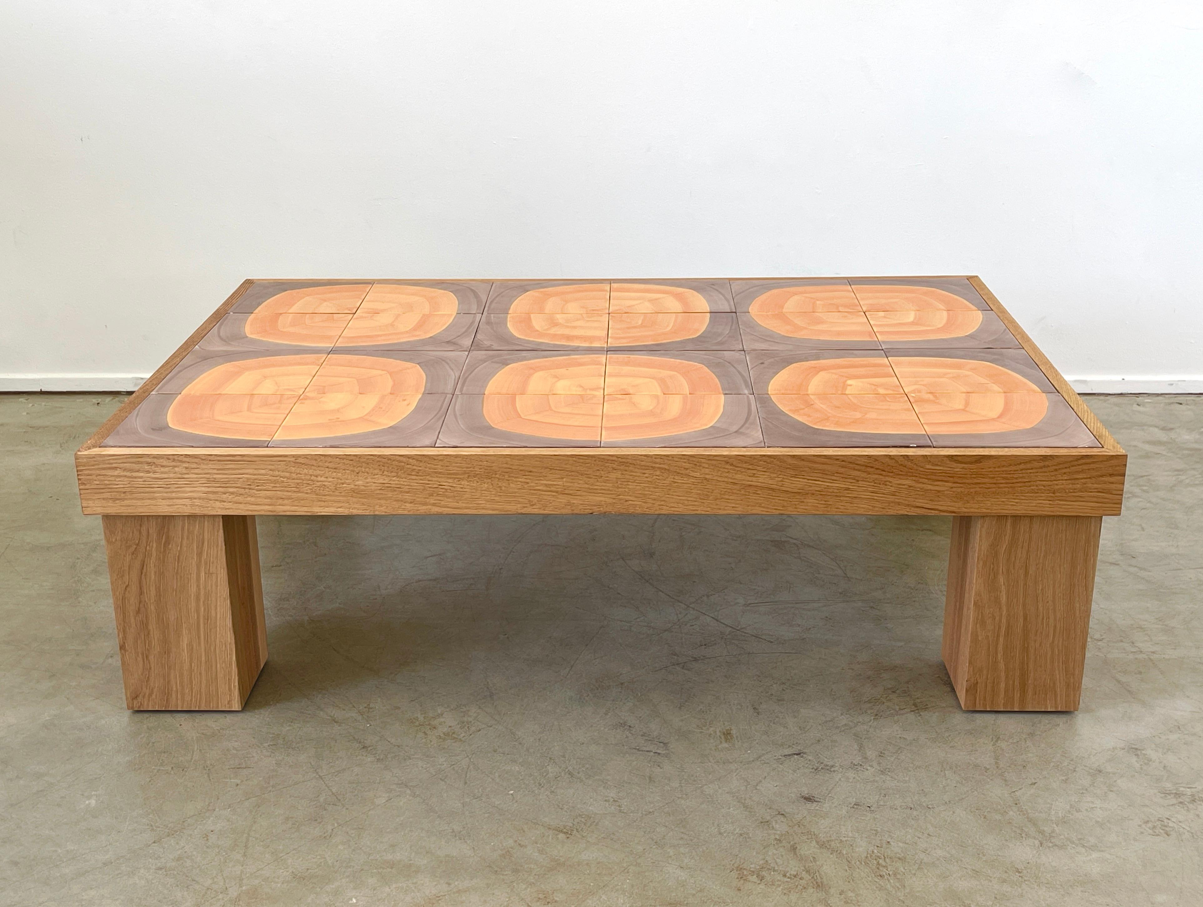 Incredibly rare 1950's French ceramic coffee table attributed to Roger Capron
Beautiful color palette of ceramic tiles - individually placed into surface of table 
New white oak base in exact dimension of original.