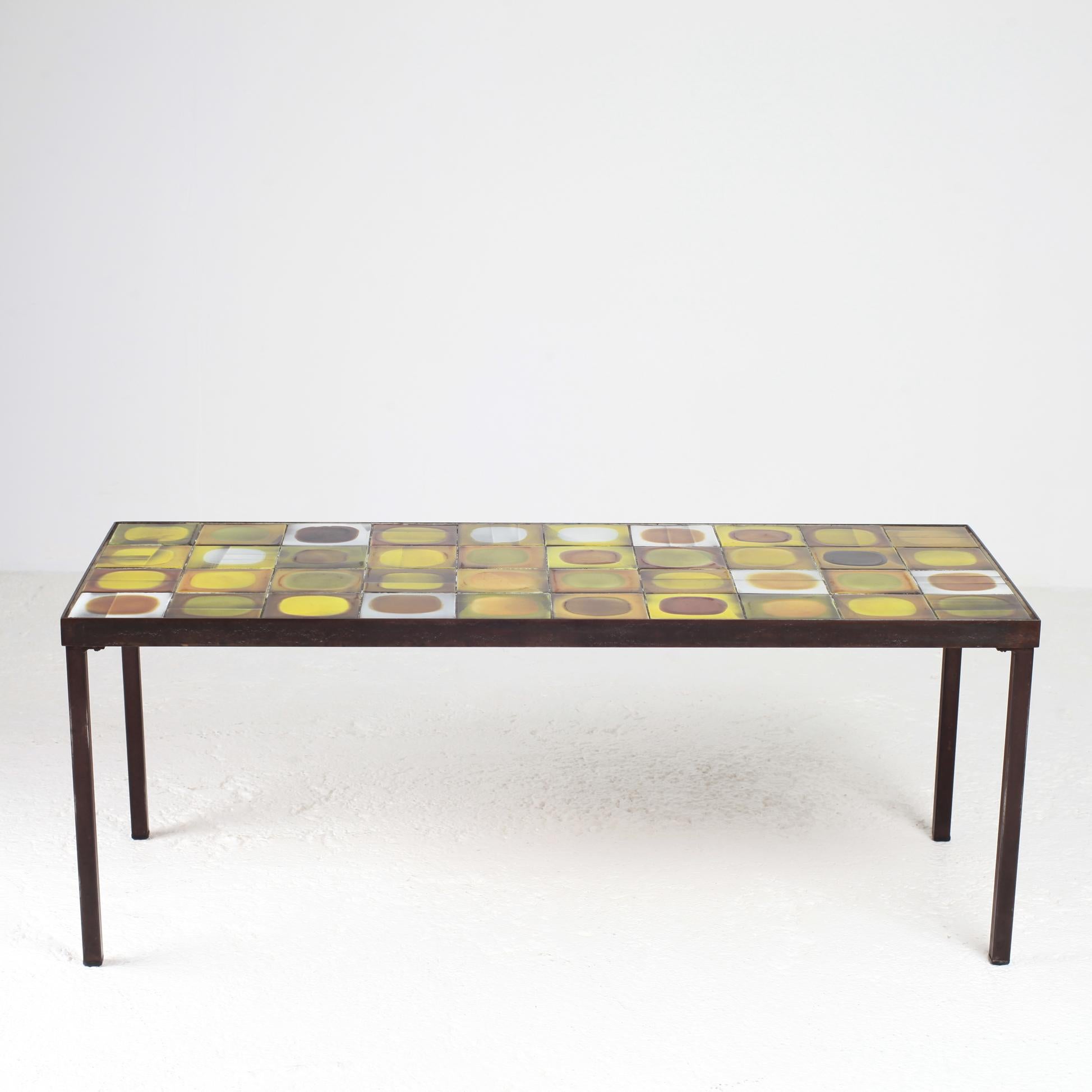 Roger Capron ceramic planete coffee Table.
Enameled ceramic tiles.
black metal Frame.
signed.
Vallauris France, circa 1960.