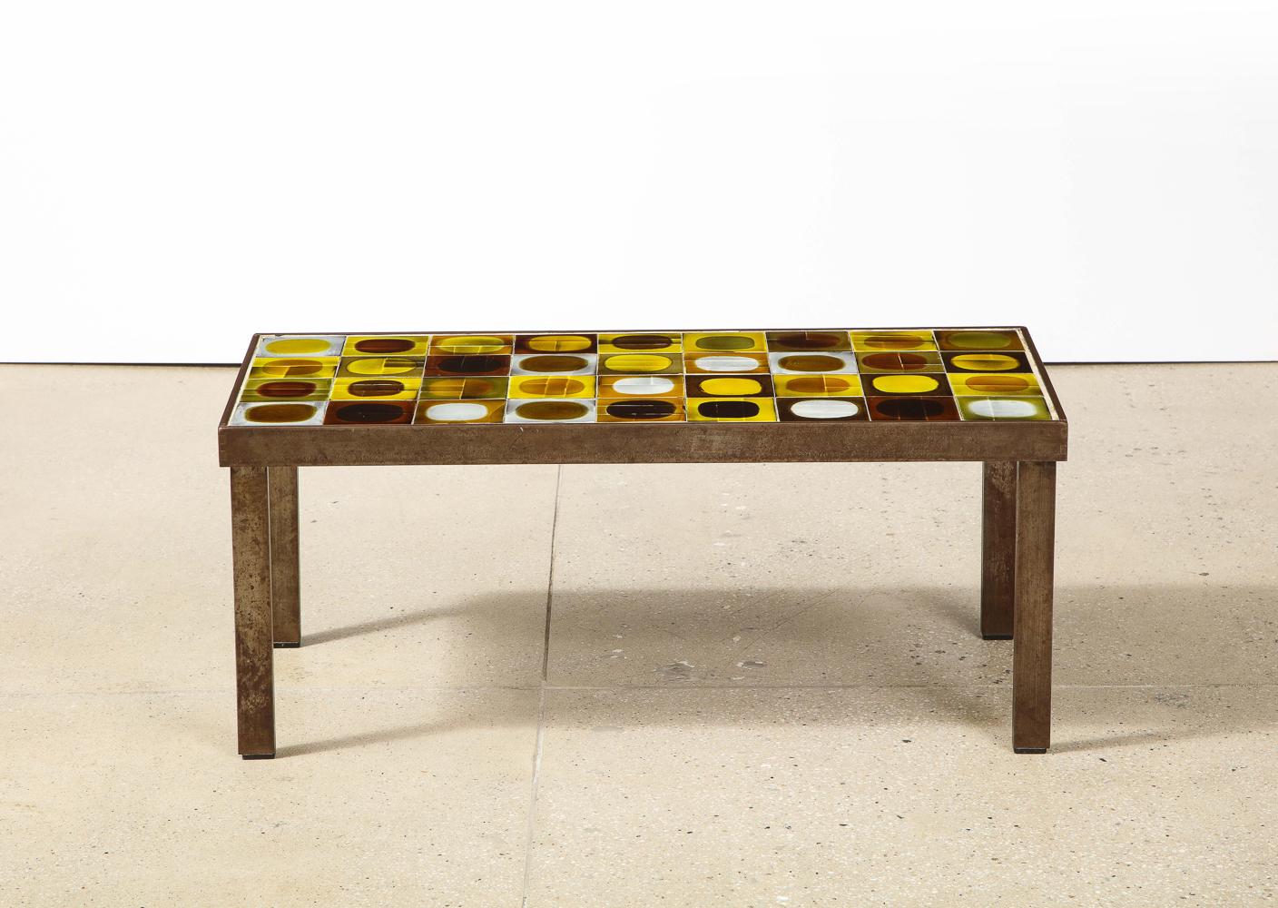 Early cocktail table by Roger Capron. Oxidized steel frame and glazed ceramic tiles. Great abstraction and colors. Artist signed. Very good original condition with overall wear to base.