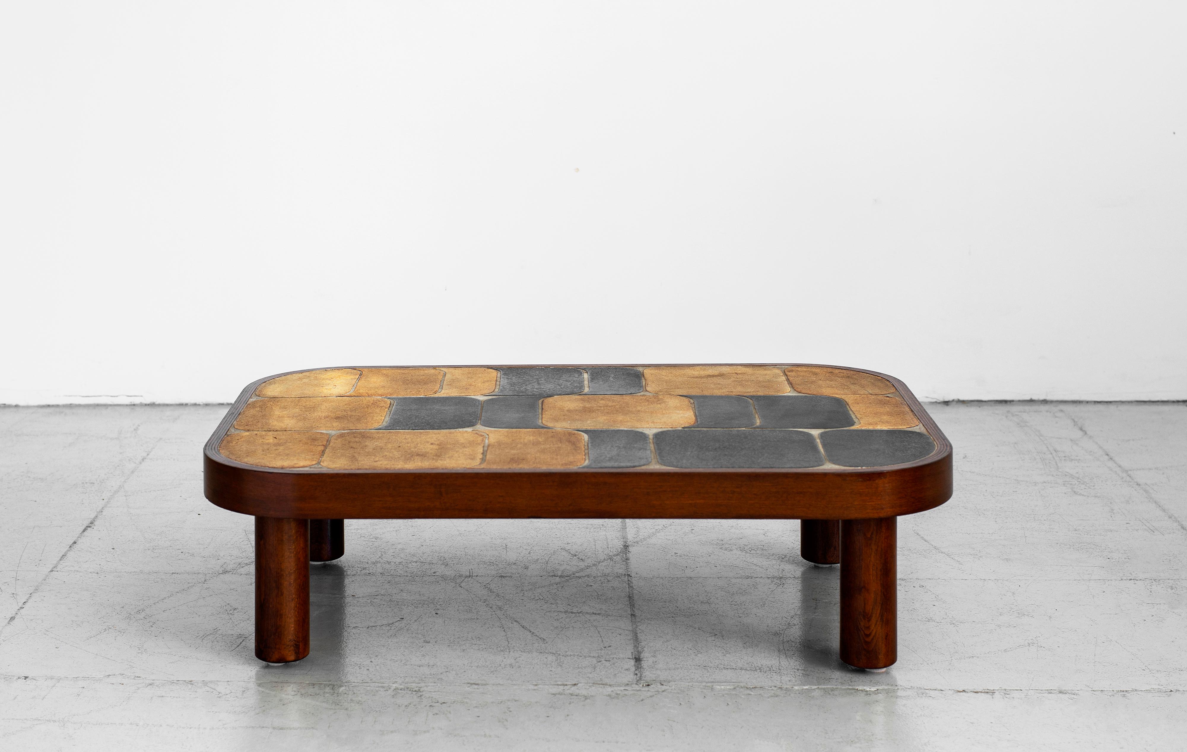 Wonderful ceramic tile top coffee table designed by Roger Capron (signed). 
Features his unique 