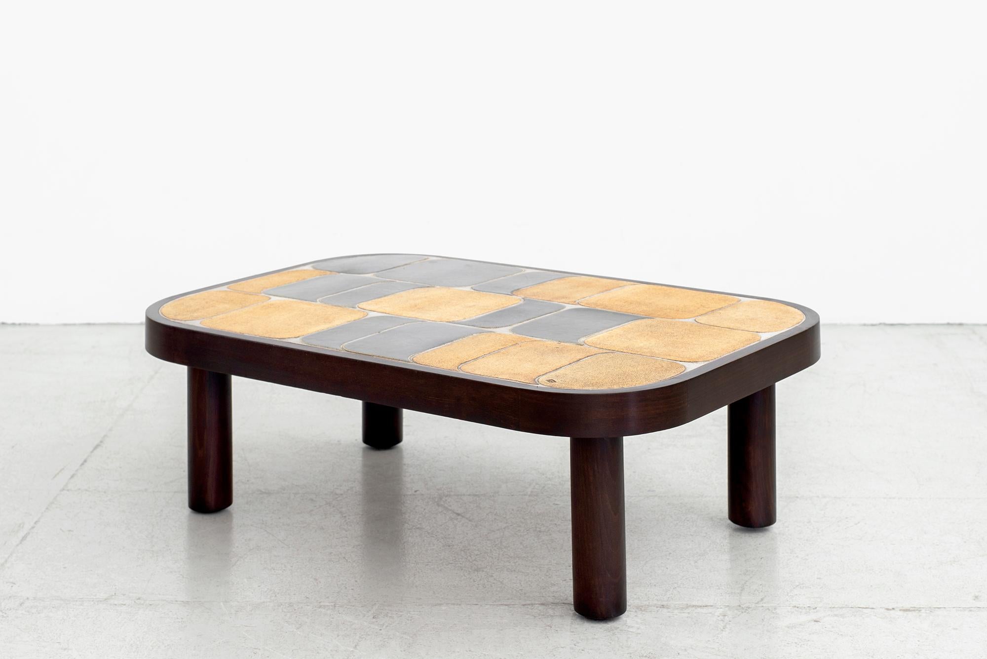 Wonderful ceramic tile top coffee table designed by Roger Capron. (signed) 
Features his unique 