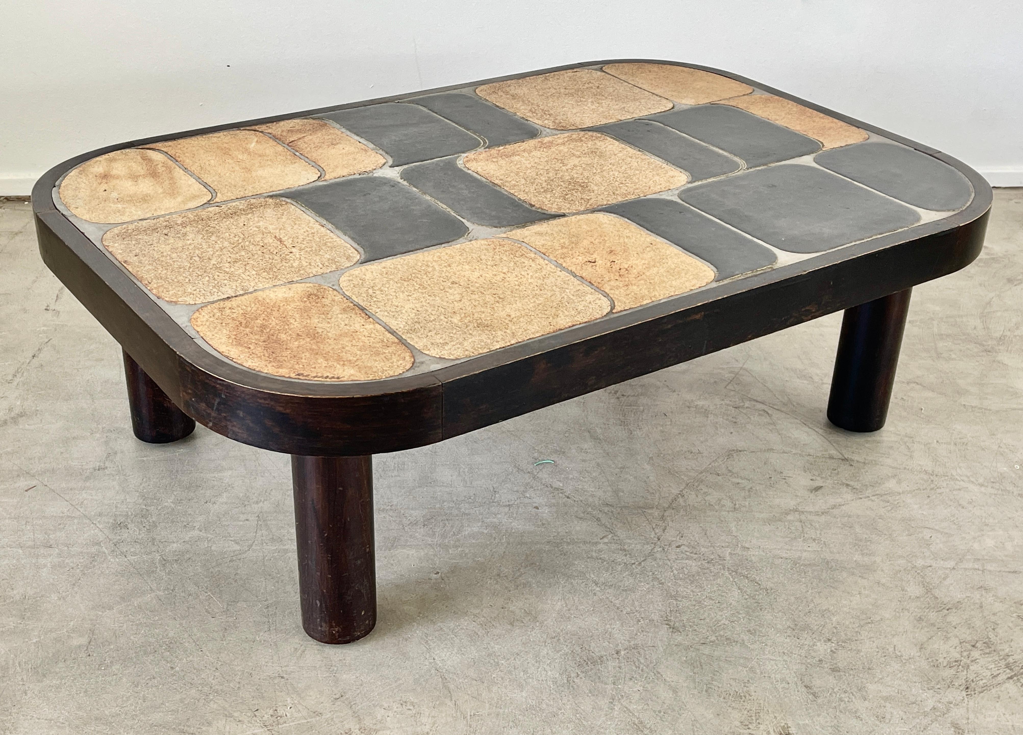 Wonderful ceramic tile top coffee table designed by Roger Capron. (signed) 
Features his unique 