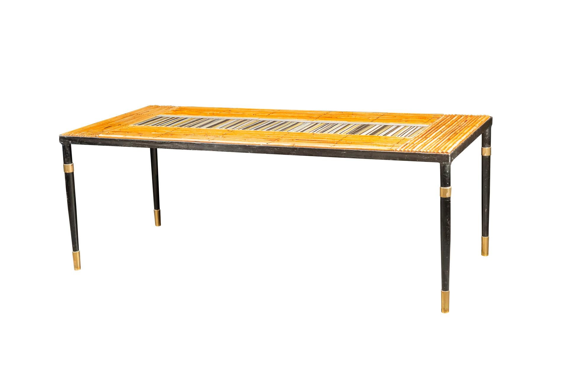 Roger Capron & Francis Bonaudi, Coffee table,
Unsigned faience, hobnailed bamboo,
Ceramic tiles by Roger Capron,
Painted iron feet, brass,
France, circa 1960.

Measures: Width 100 cm, depth 45 cm, eight 36 cm.

Roger Capron, born in Vincennes on