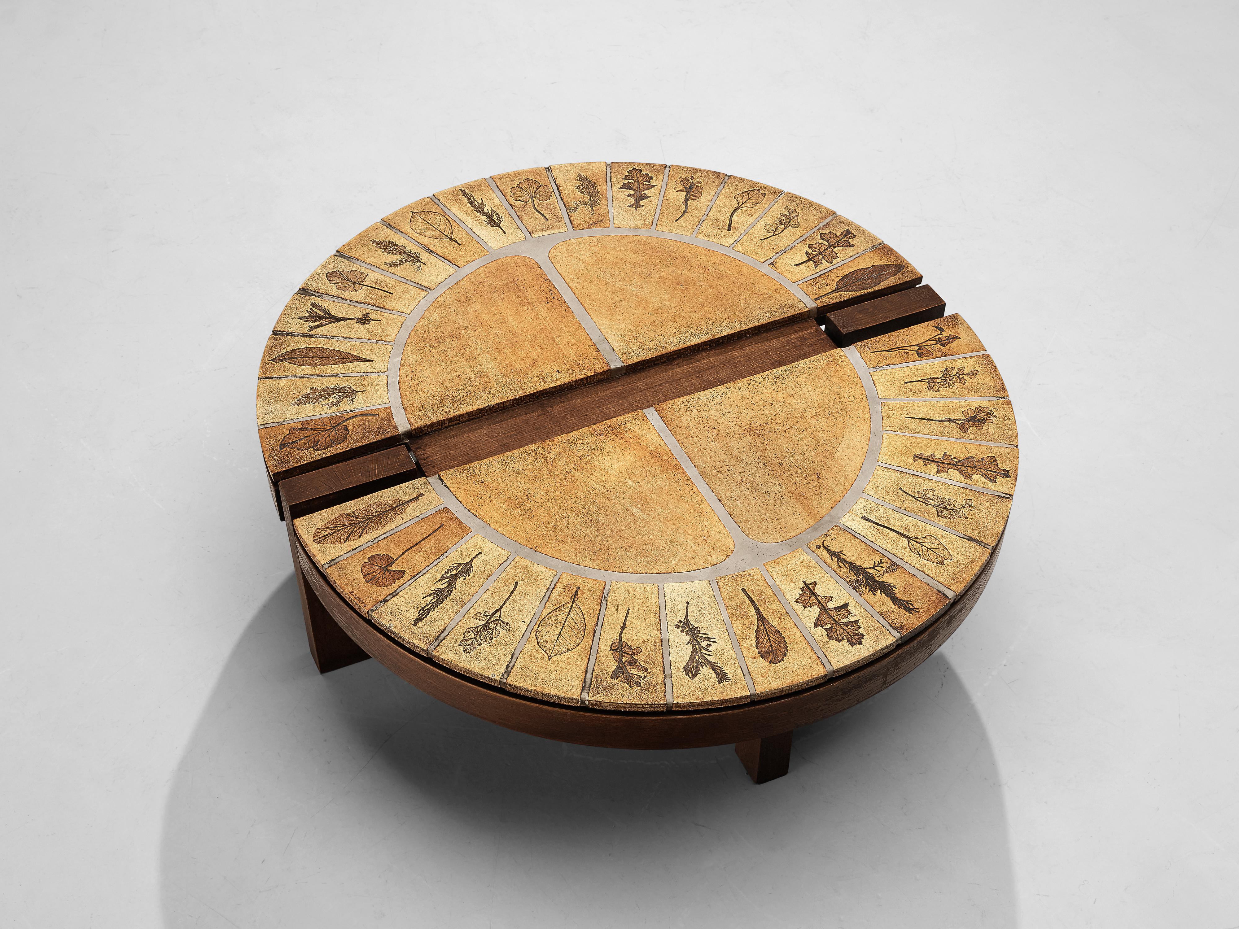 Roger Capron, coffee table, wood, ceramic tiles, France, 1960s

Beautiful and detailed round coffee table with delicate details on the ceramic top. The table comes from the 'Garrigue' series and has an elegant designed top that is equipped with
