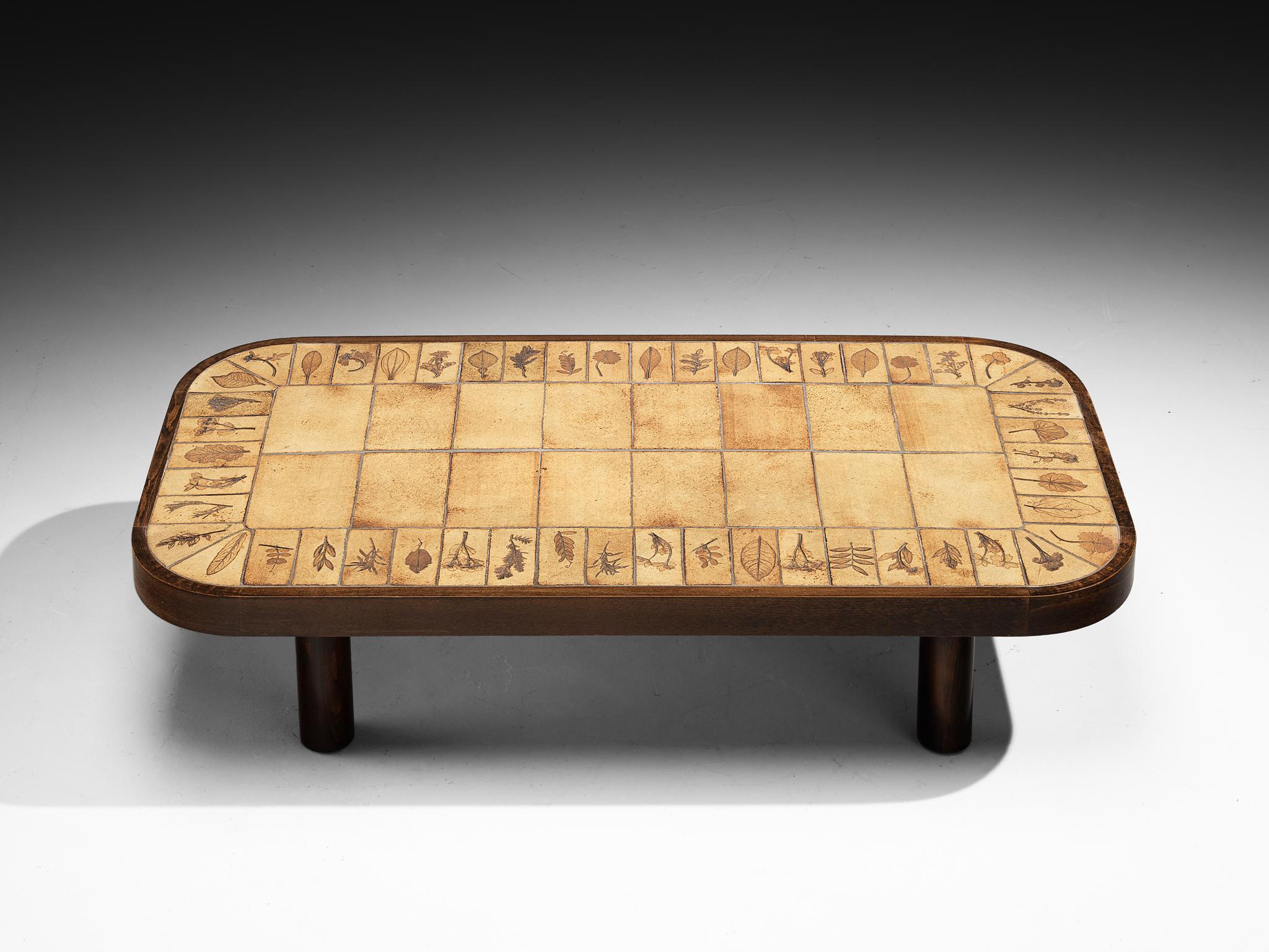 Roger Capron coffee table, France, 1970s

This elegant French rectangular coffee table from the 1970s is a design by Roger Capron, known for his iconic ceramic work. The tabletop is composed of ceramic tiles bordered with artistic imprints of