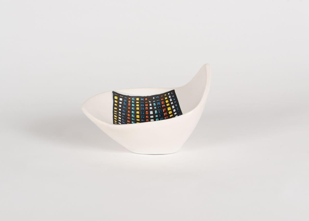 Roger Capron, the celebrated French mid-century ceramist, created a large body of work notable for its elegance, varied sources of inspiration, and expert execution. This beautiful, glazed pattern is one of series  in which he sets a vibrant array