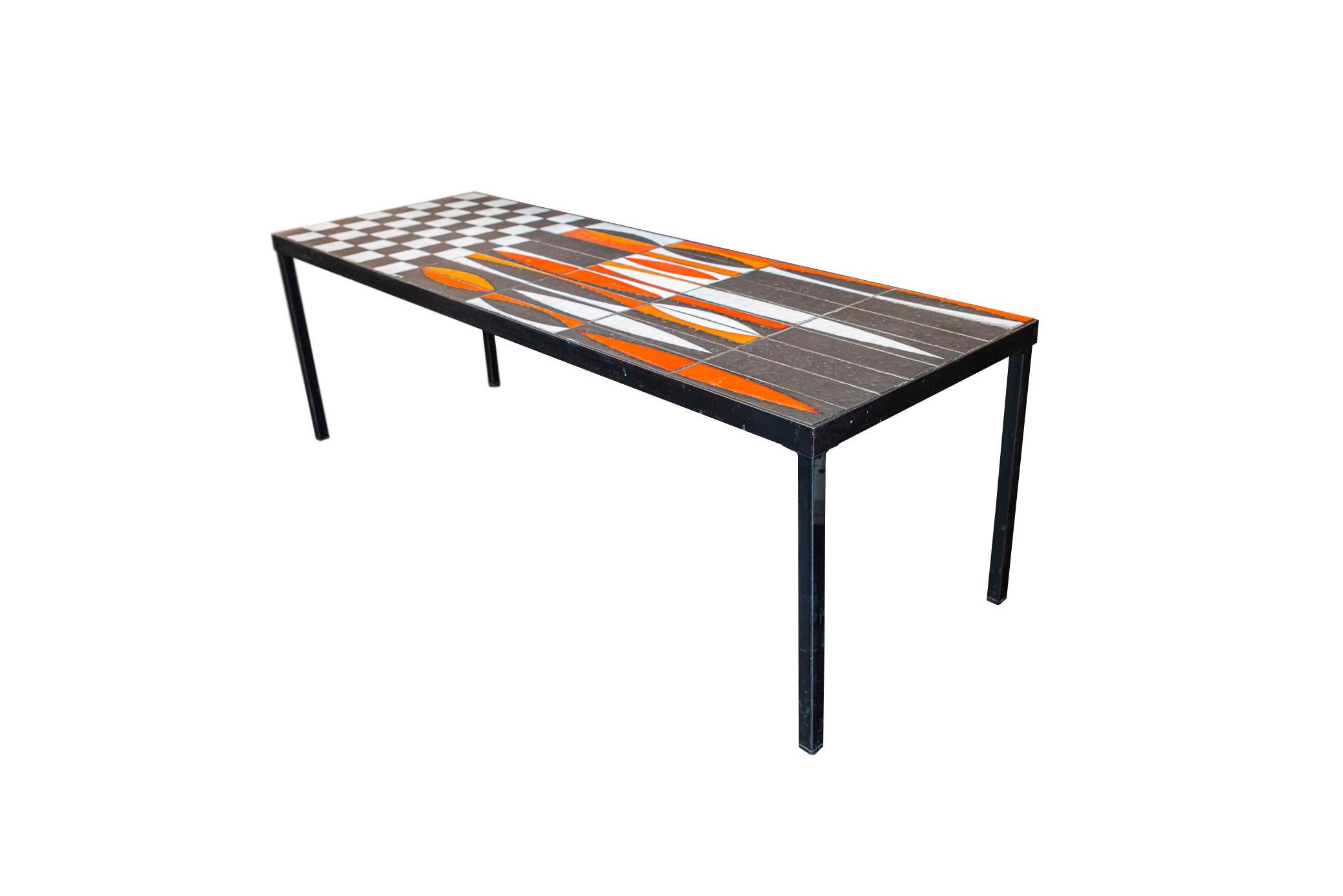 Roger Capron, important coffee table,
Ceramics tabletop decorated with diamonds and checked pattern (special command),
Black lacquered iron feet,
Signed, Slight damage on the signature,
France, circa 1960.

Measures: Width 120, Depth 41,
