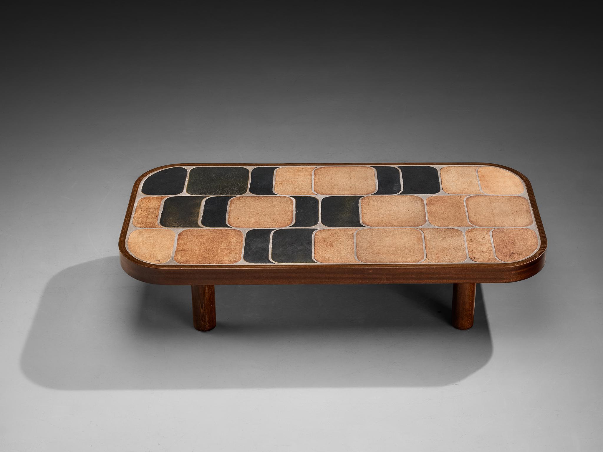 Roger Capron, ‘Sou-Chong’ coffee table, ceramic, mahogany, beech, France, 1971

Lovely French coffee table with wonderful composed ceramic tiles by French designer Roger Capron. This specific model is the larger version within the ‘Sou-Chong’ line.