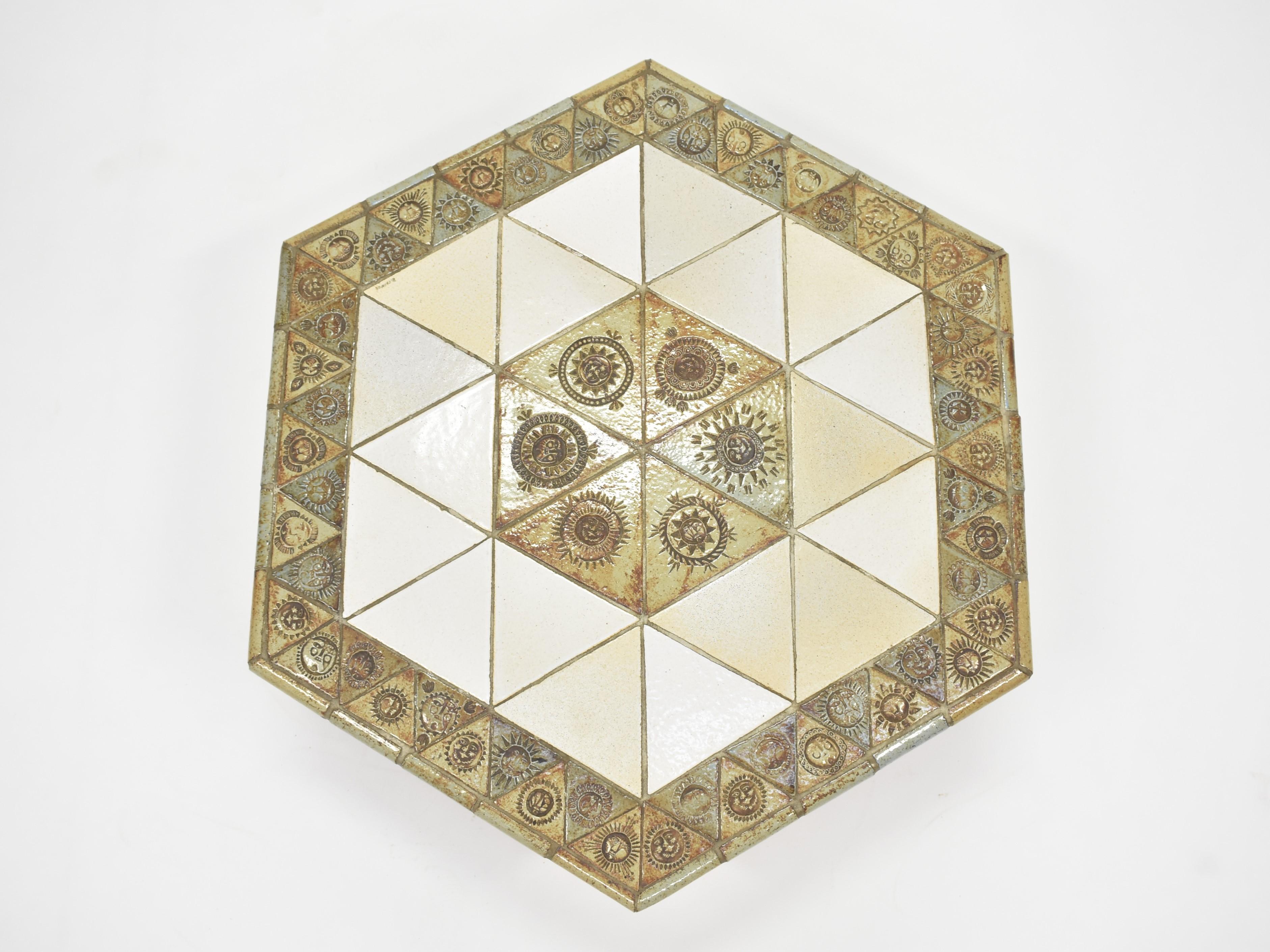 Roger Capron walnut and ceramic tile octagonal coffee table. The triangular tiles are likely Garrigue, which Capron used frequently. The four round legs are constructed of walnut. 