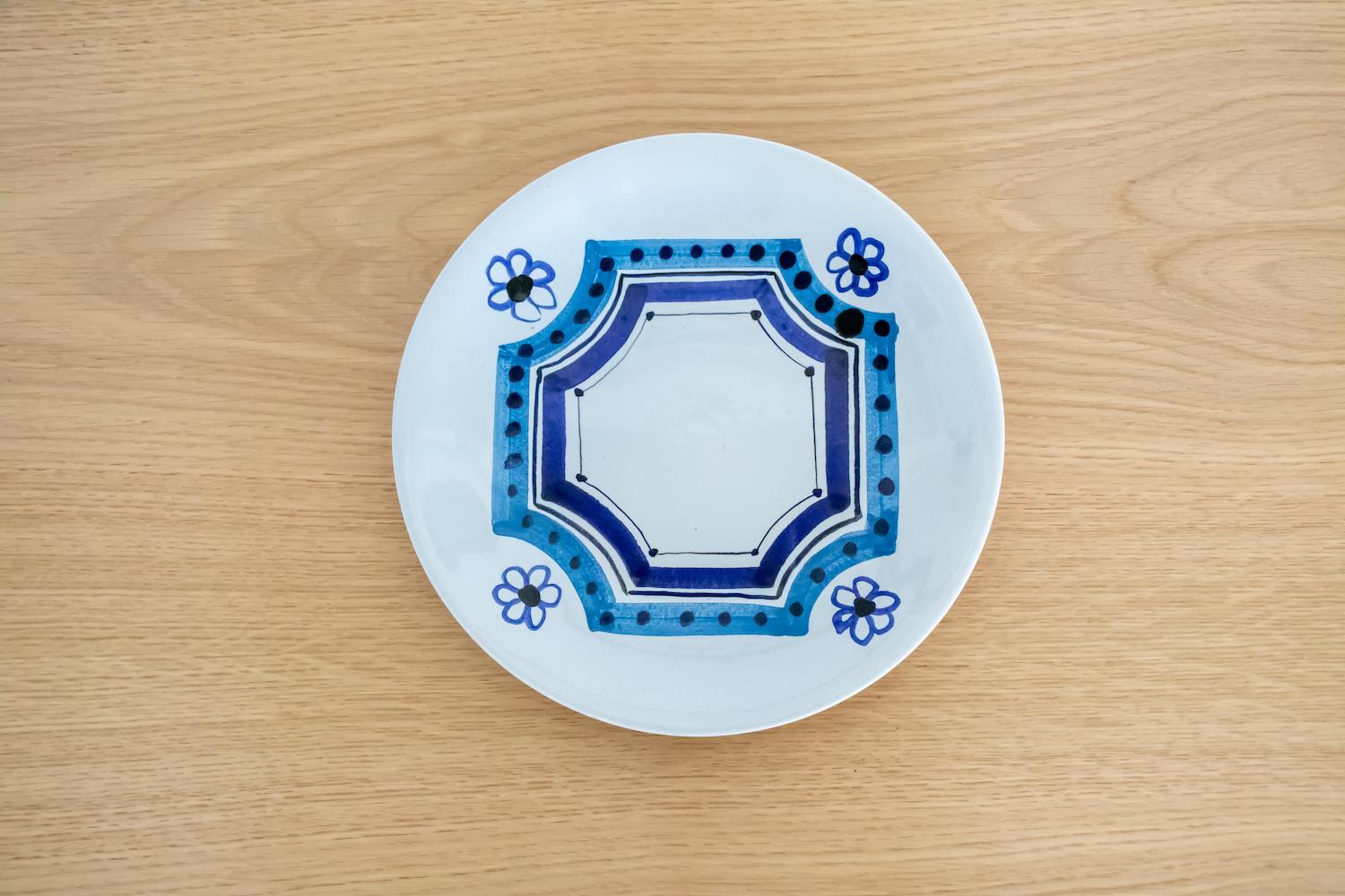 Beautiful ceramic hand painted plate with blue and white flower motif by Roger Capron from France, 1950's. Signed on back.