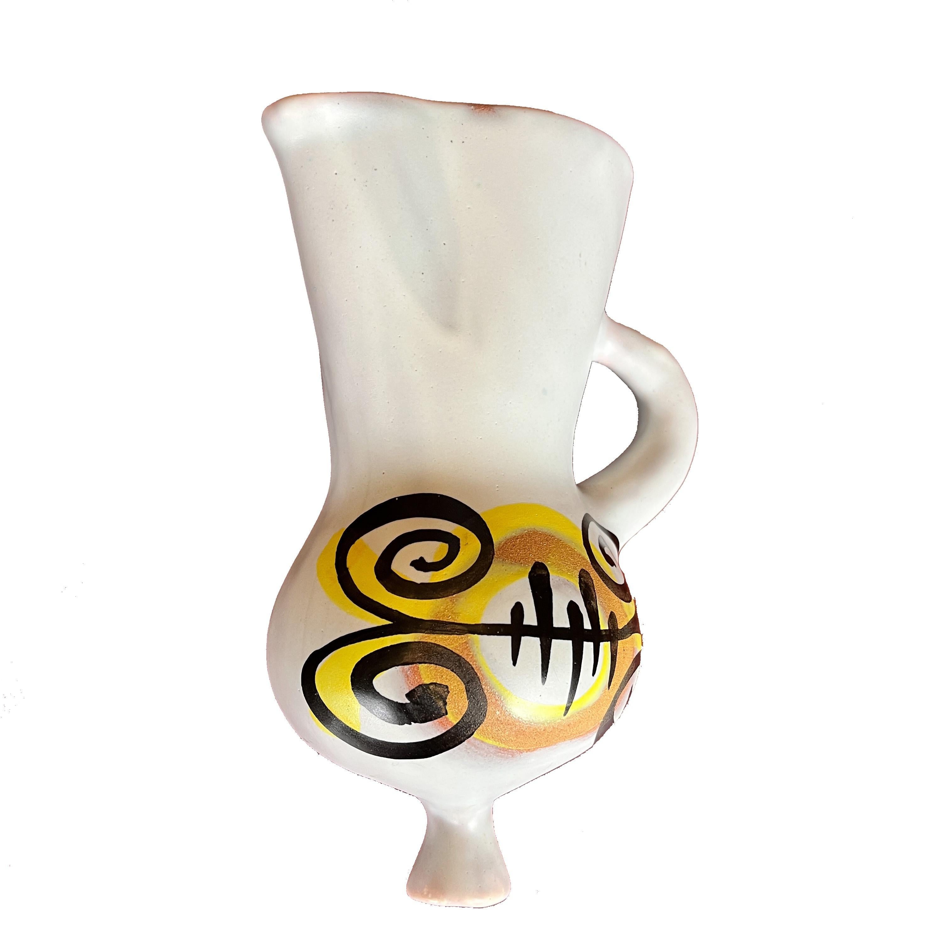 A rare wall flower vase by Roger Capron (1922-2006) in white ceramic with patterned design created using paraffin during the glazing process, as well as a black / yellow painted pattern on the belly.

This large piece (20cm) is initialed at the flat