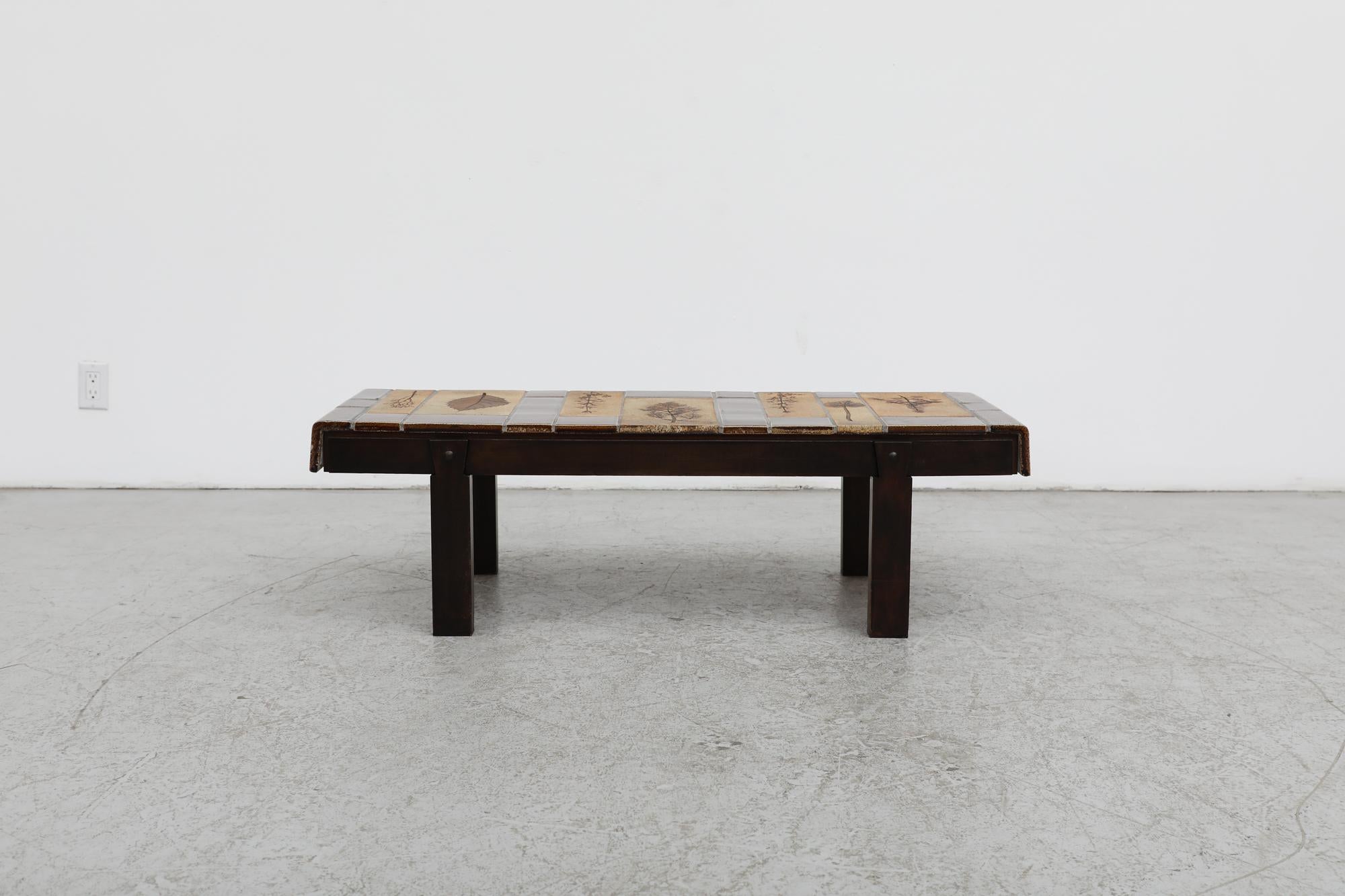 Mid-century Roger Capron 'GARRIGUE' coffee table with rectangular wood frame and pressed leaf tile work from Vallauris, France. A major contributor to the french ceramics golden age this table exemplifies Capron's passion for ceramic arts and