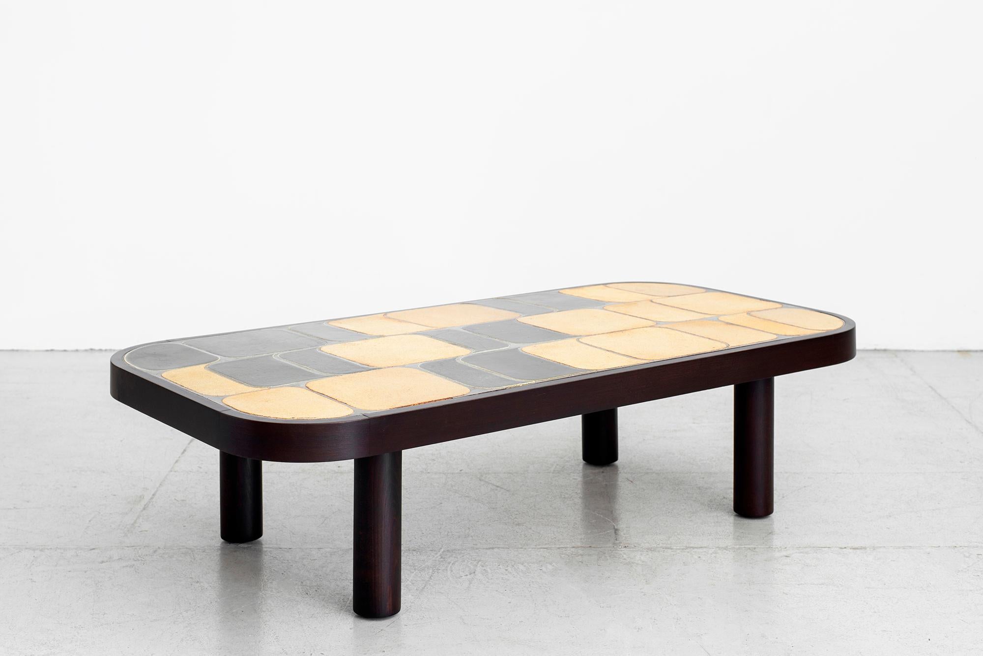 Large sized ceramic tile top coffee table designed by Roger Capron (signed).
Features his unique 