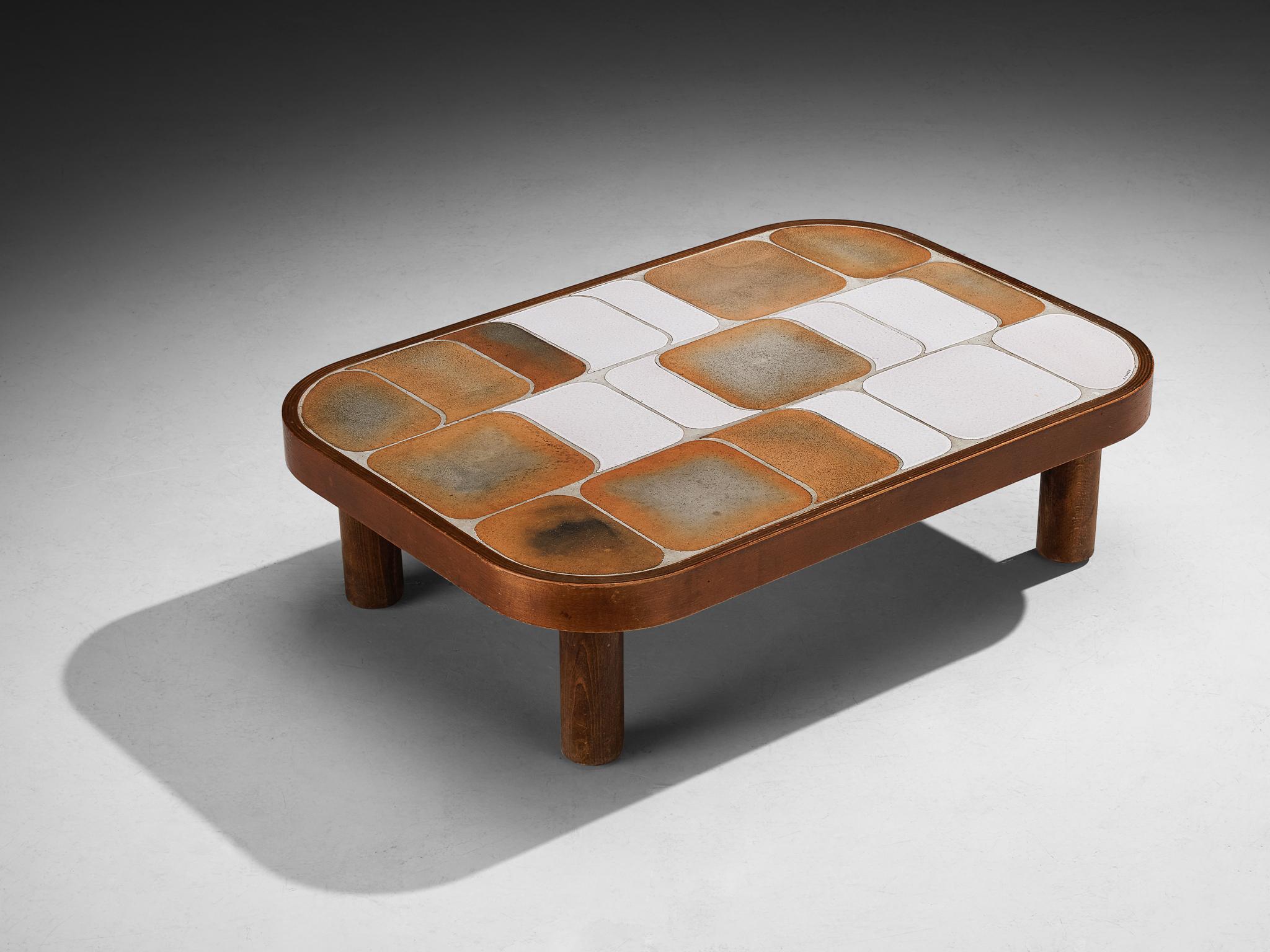 Roger Capron, 'Shogun' coffee table, ceramic, beech, France, 1960s

Lovely French coffee table with wonderful composed ceramic tiles by French designer Roger Capron. Both the tiles as well as the frame feature rounded corners. The tiles have