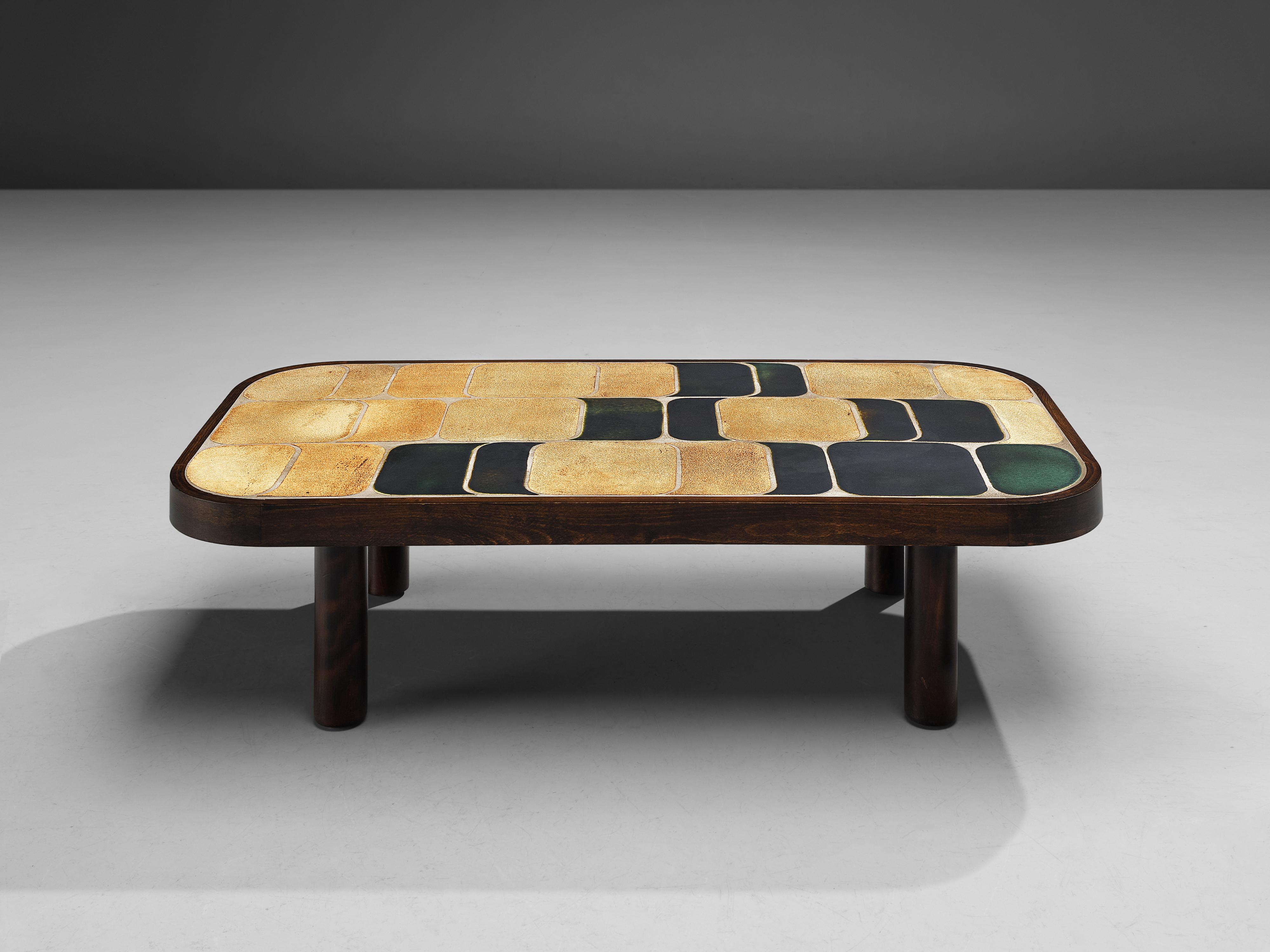 Roger Capron, 'Shogun’ coffee table, bi-color ceramic, beech, France, 1960s

French coffee table with wonderful composed ceramic tiles by French designer Roger Capron. Both the tiles as well as the frame feature rounded corners. The tiles have