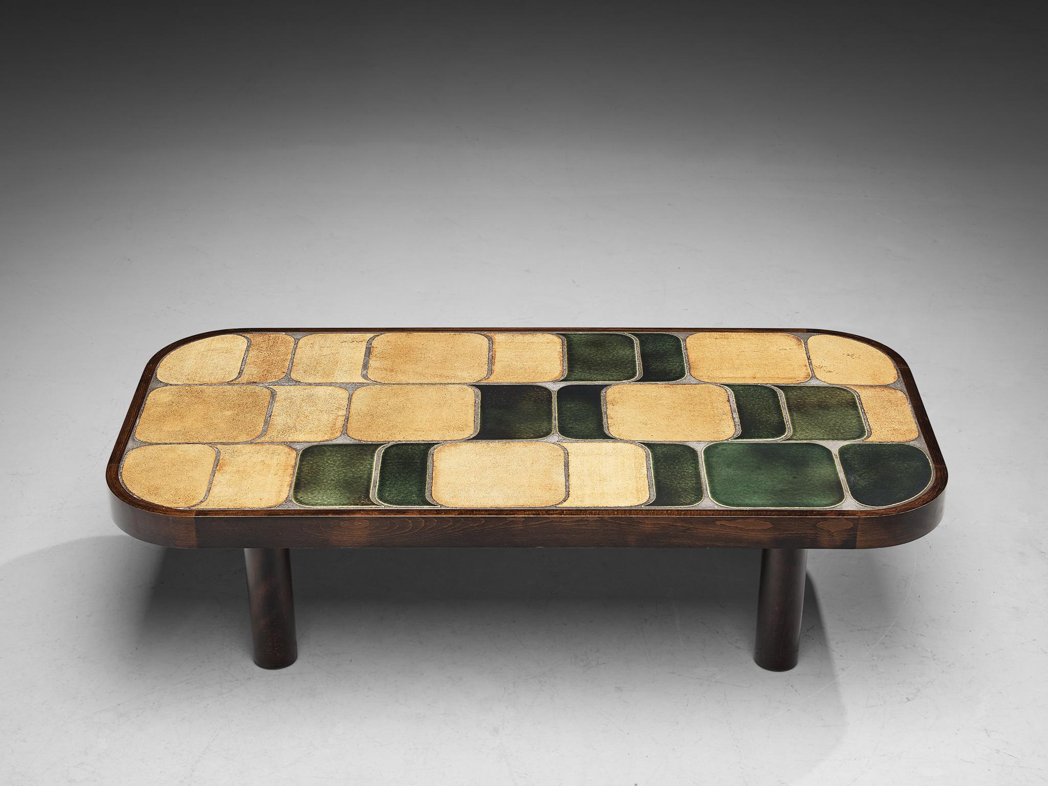 Roger Capron, 'Shogun’ coffee table, bi-color ceramic, beech, France, 1960s

French coffee table with wonderful composed ceramic tiles by French designer Roger Capron. Both the tiles as well as the frame feature rounded corners. The tiles have