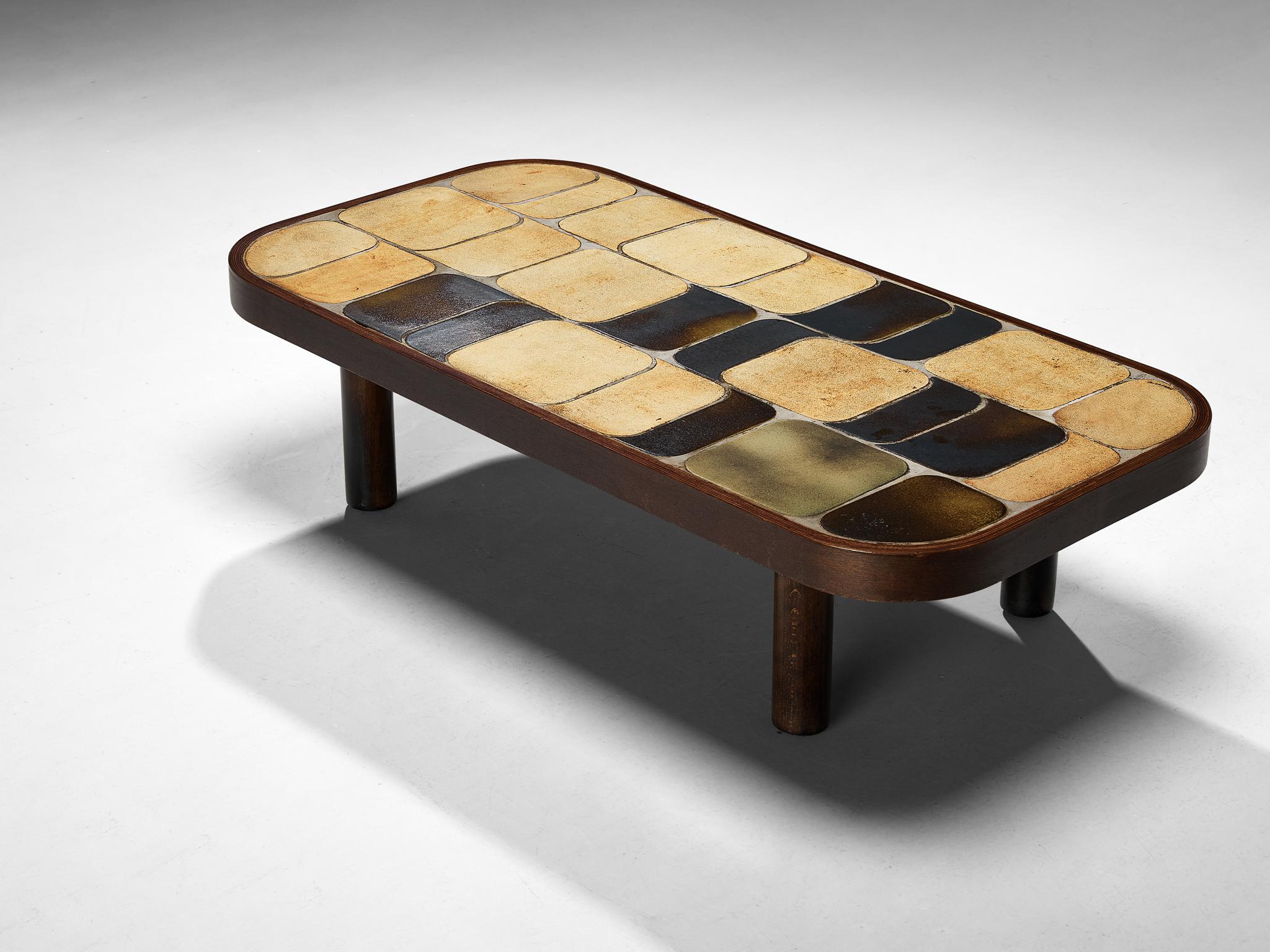 Roger Capron, coffee table, ceramic, stained beech, France, 1960s

Lovely French coffee table with wonderful composed ceramic tiles by French designer Roger Capron. Both the tiles as well as the frame feature rounded corners. The tiles have