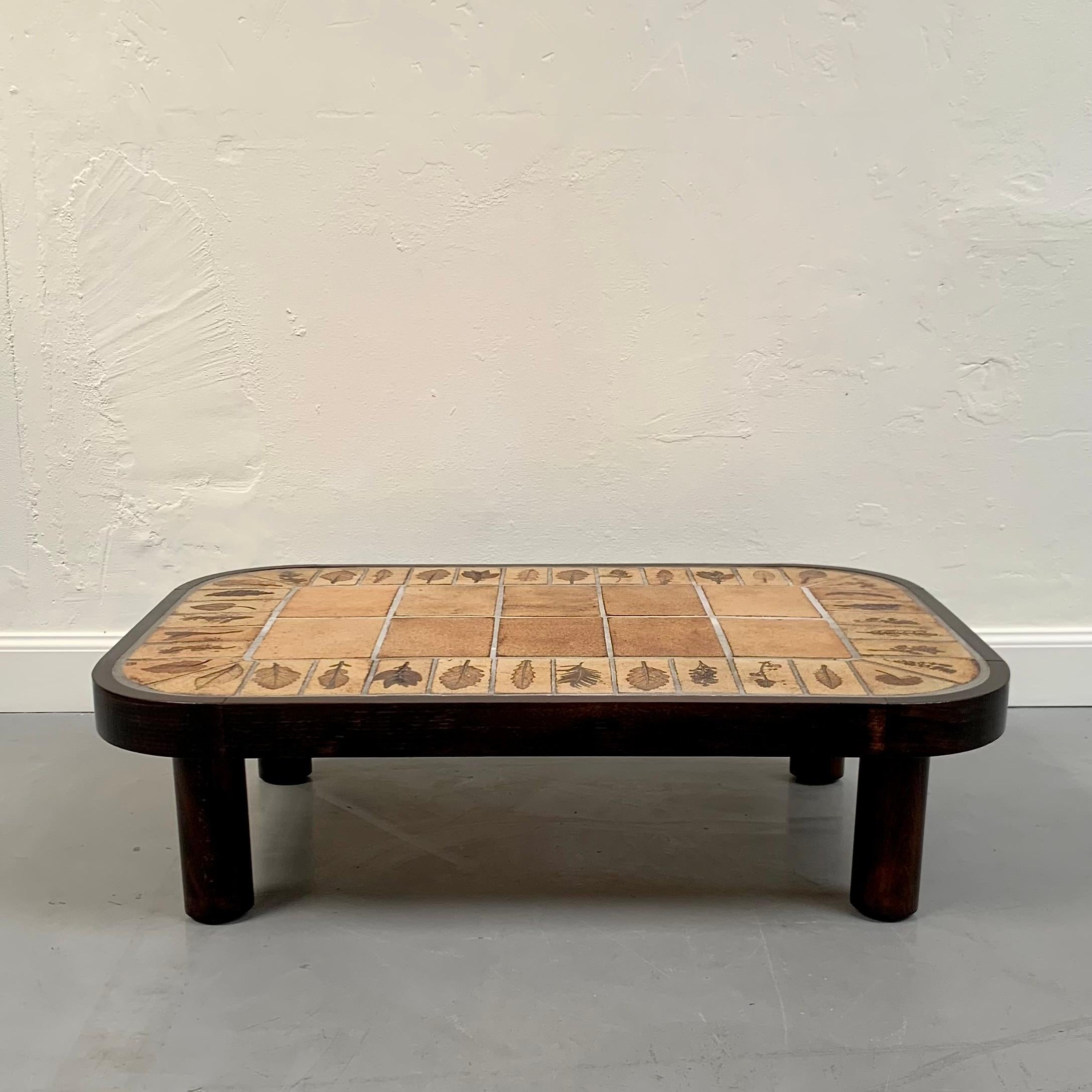 Rare Roger Capron signed ceramic coffee table, circa 1965.
Nice Herbier model.
Ceramic tiles,  grass motifs, tinted oak frame and feet. 
Signed R. Capron on one ceramic tile.
Good Original Vintage Condition.
Dimensions : 98 cm W ( 38,58 in), 68 cm D