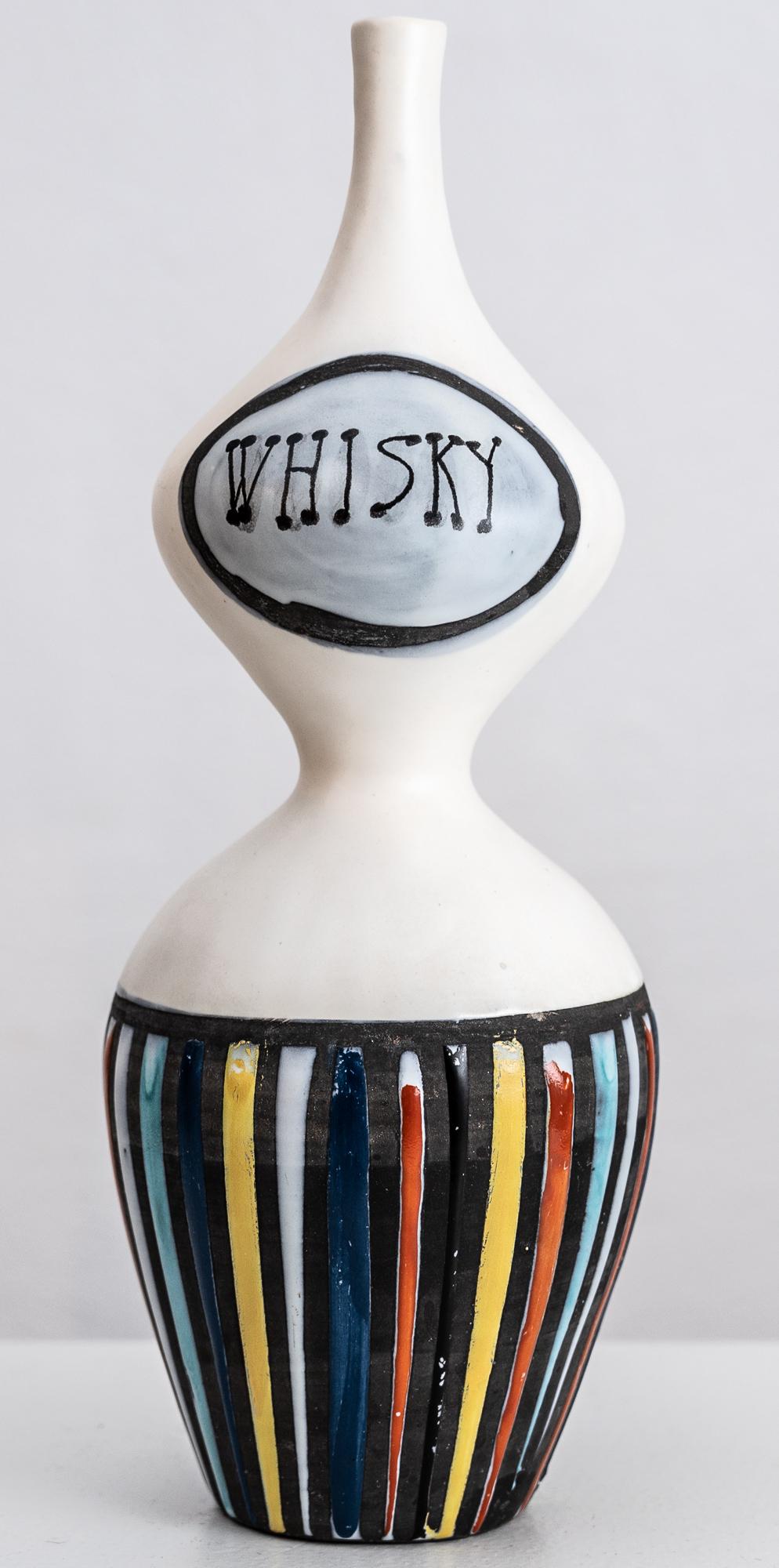 Roger Capron anthropomorphic shaped ceramic whisky bottle in pyjama stripes. Signed to the underside “Capron Vallauris 39A”

Vallauris France, circa 1950

Roger Capron was born in Vincennes, France on September 4, 1922. Interested in drawing, he