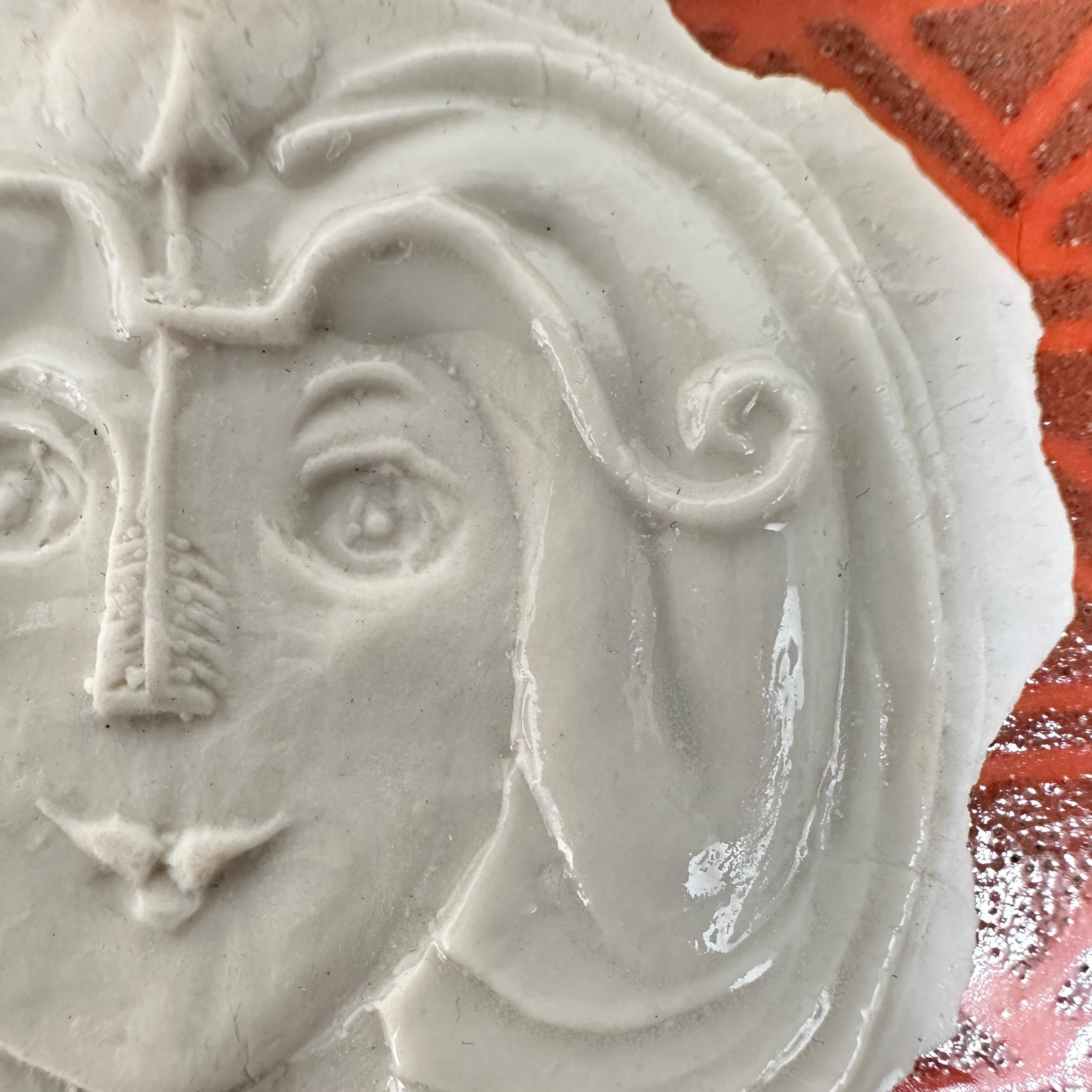 Thin sheet of partially glazed stamped porcelain with the motif of a female figure embodying the Sagittarius sign.

Rare item from a limited series created by the artist in 1973 around the zodiac signs.

Although unsigned, this delicate artist's