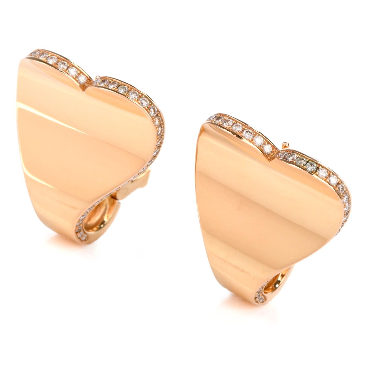 These Roger Dubuis love filled Diamond Earrings were inspired in a Heart motif

and crafted in 18 Karat Yellow Gold.

100 round brilliant cut diamond adorn the outer most edges and weigh approx. 1.00 carat and are of F-G color and VVS2-VS1