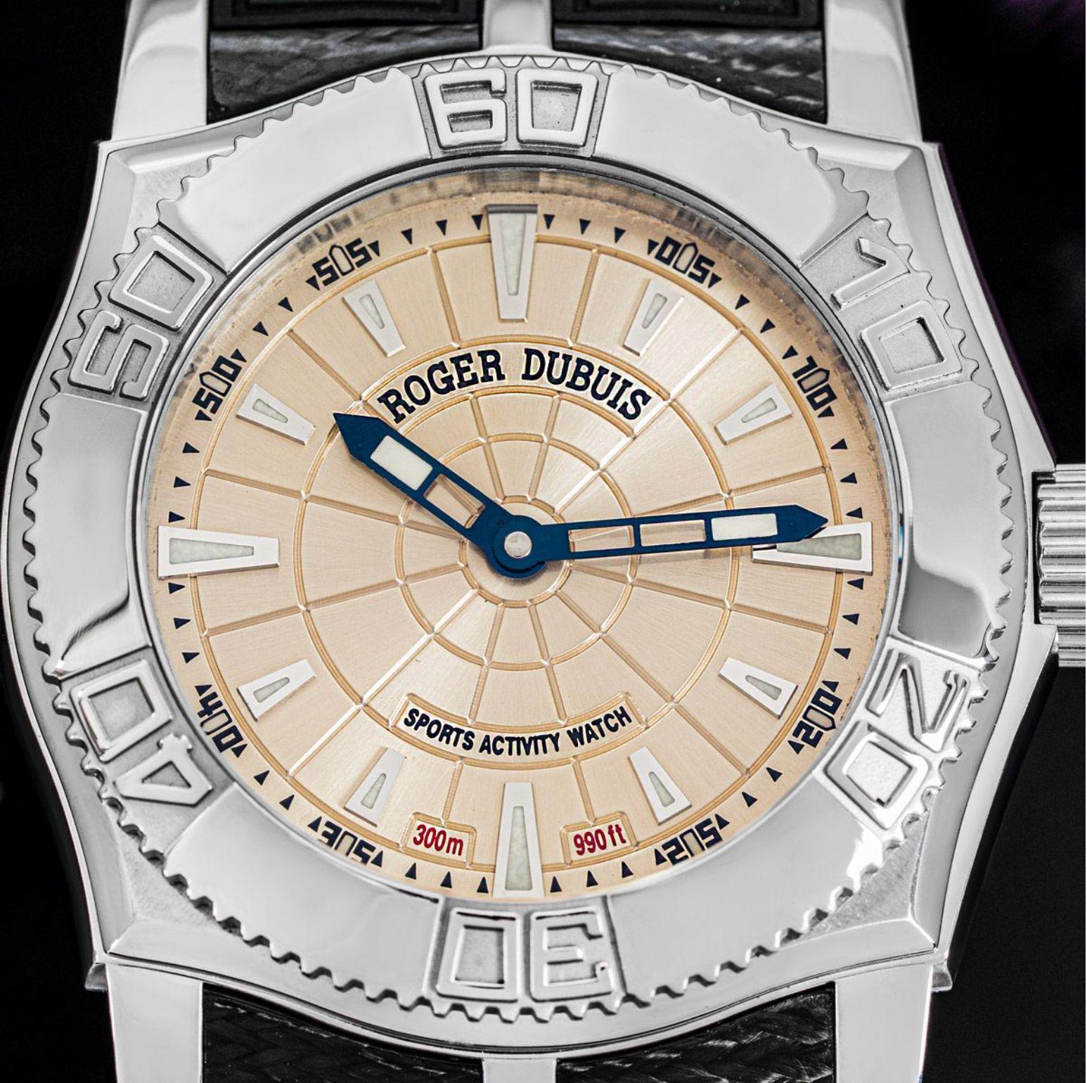 A mens Easy Diver wristwatch crafted in stainless steel by Roger Dubuis. Featuring a champagne dial with applied hour markers and a steel rotating bezel. The watch is also fitted with a sapphire glass, a self-winding movement which can be seen via