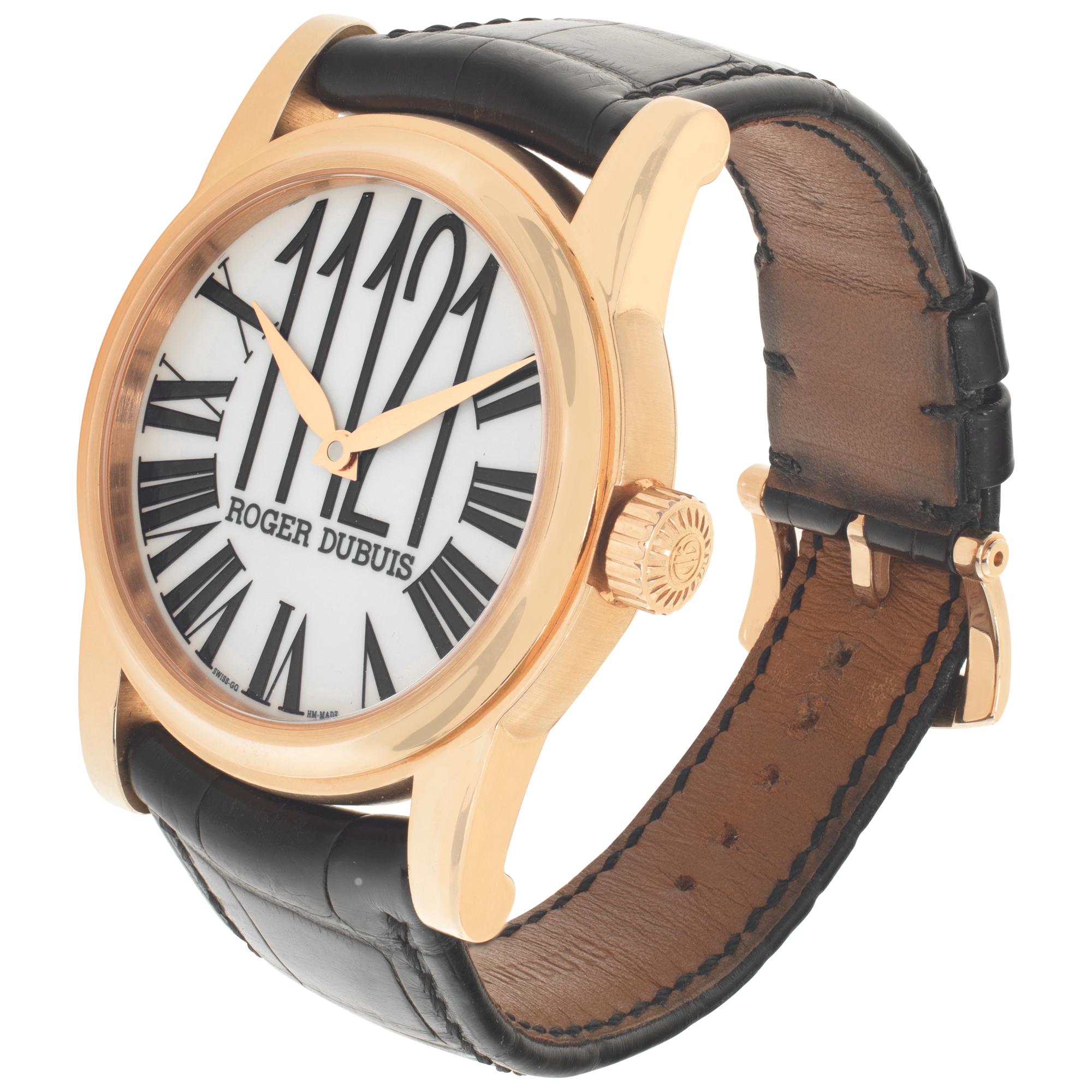 Roger Dubuis Hommage in 18k rose gold on a black crocodile strap with a Roger Dubuis 18k rose gold tang buckle. The dial shows Roman numerals aside from the 