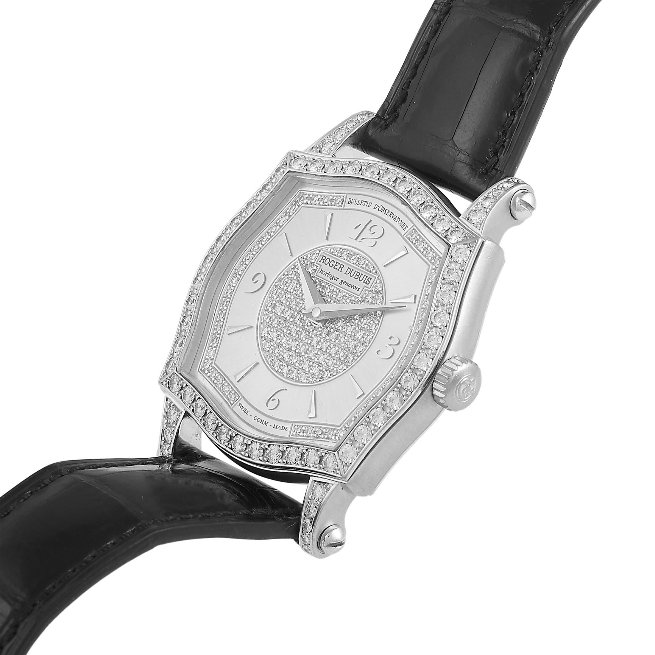 This Roger Dubuis Sympathie 18K White Gold Diamond Ladies Watch S37 575 is designed with the perfect balance of functionality and glamour. It features a solid three-body case with a one-of-a-kind square-cambered shape. Its four-section bezel is