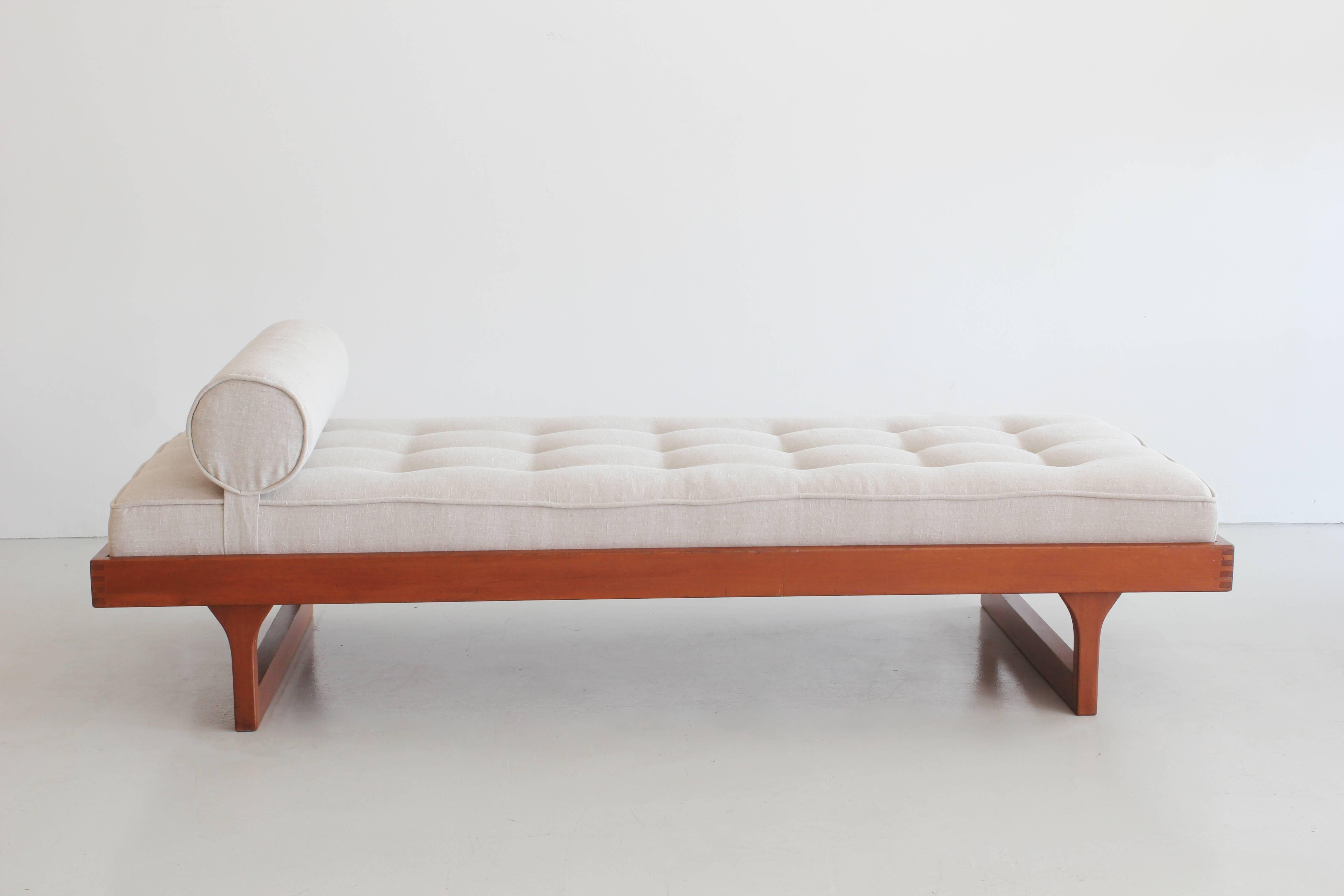 Classic French daybed with tufted cushion and adjustable bolster pillow.