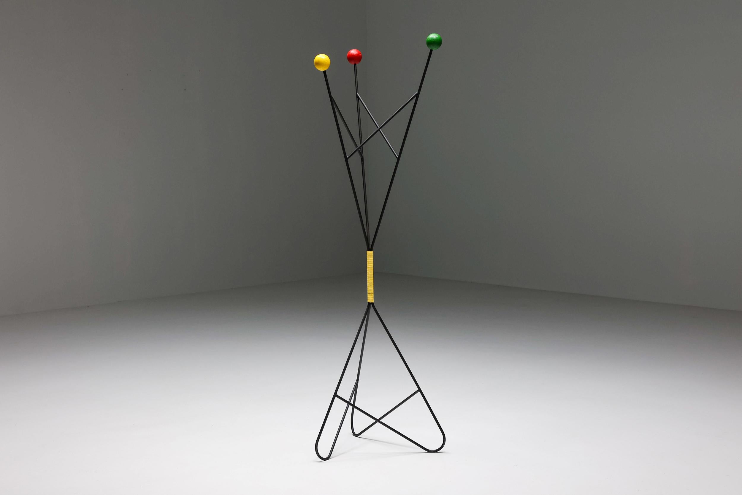 French mid-century coat rack by Roger Feraud for GEO. Made of black iron with colorful spheres as coat hooks. A functional and vibrant piece that brightens up the space.