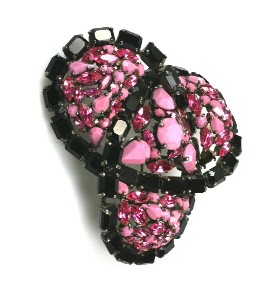 Roger Jean -Pierre massive, dimensional clip brooch of  trefoil design set with faceted jet  rectangles, hot pink and opaque  pink Swarovski stones.The body of the clip brooch is set in antique silver gilt. Marked Depose. Beautiful quality.