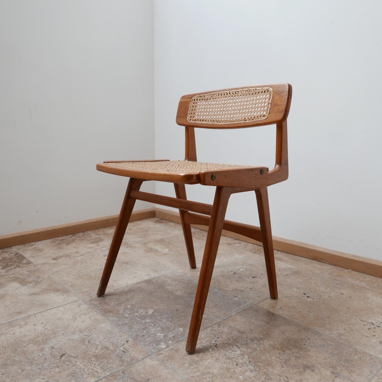 A scarce desk chair by Roger Landault,

France, circa 1950s.

Mahogany and cane.

Very stylish with amazing lines. 

The cane remains in near perfect condition, there may be one or two lines that have split but they are barely noticeable and
