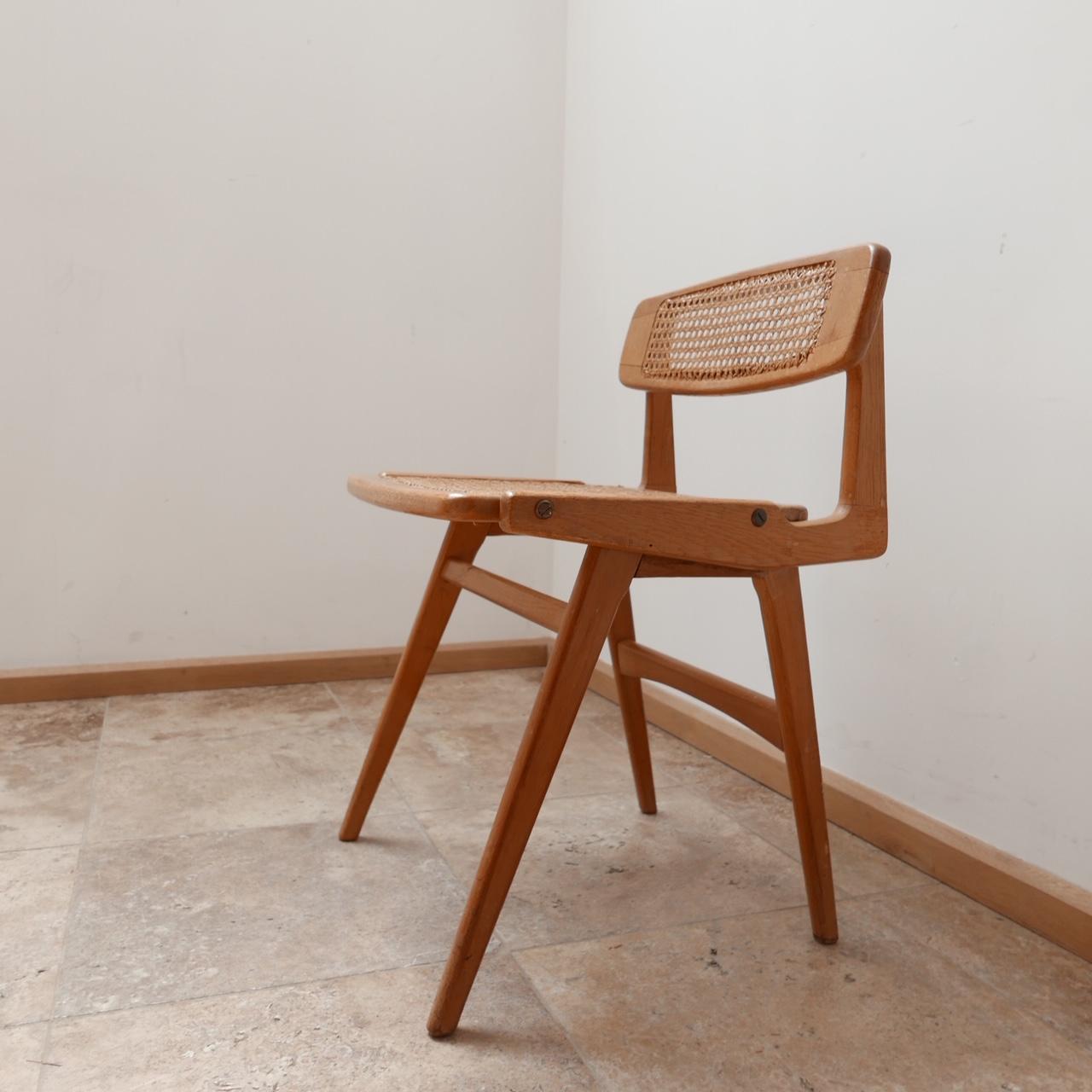 A scarce desk chair by Roger Landault. 

France, c1950s.

Mahogany and cane. 

Very stylish with amazing lines. 

Good condition. 

Dimensions: 48 W x 45 D x 45 seat height x 69 total height in cm. 

Delivery: POA.

 