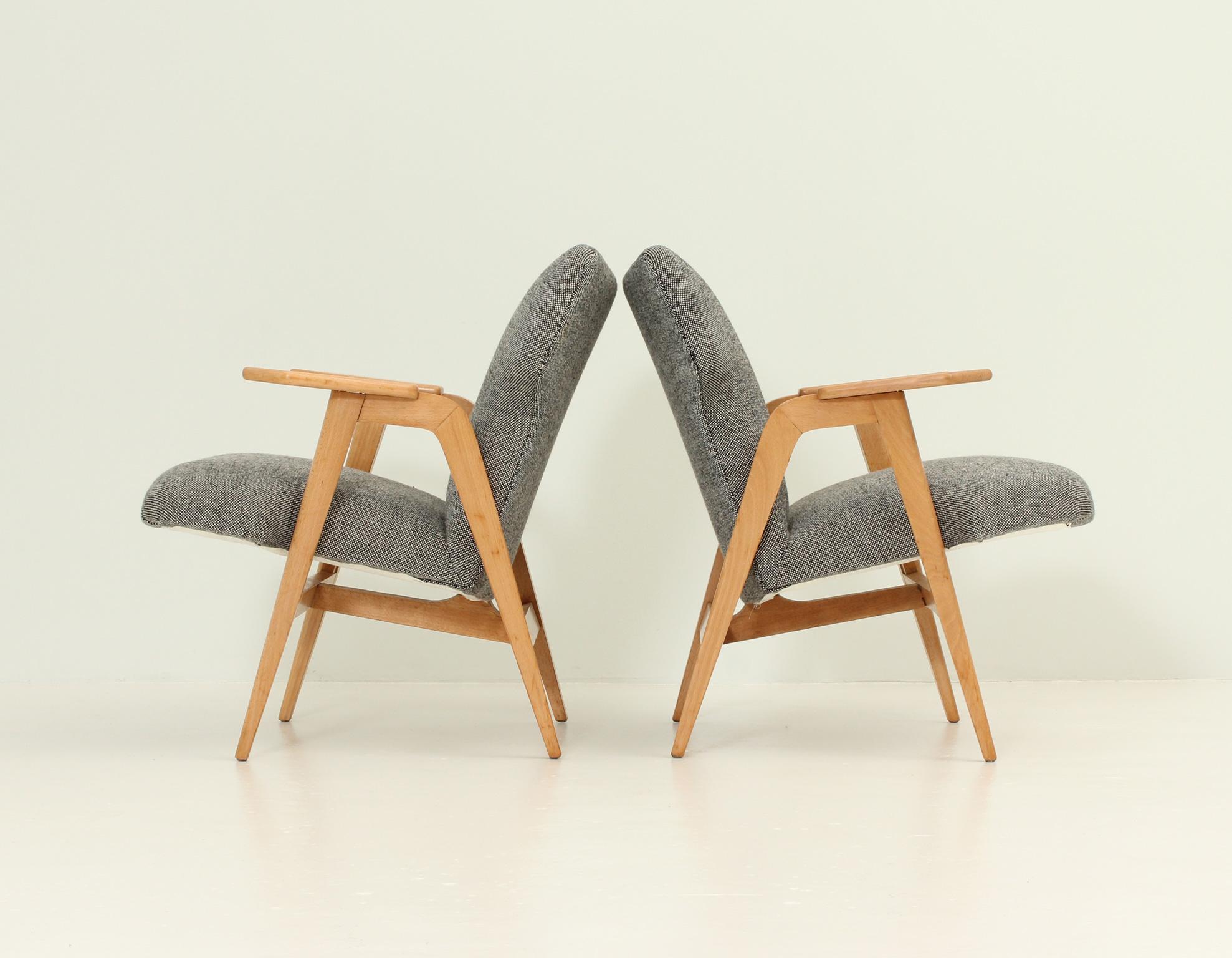 Pair of armchairs designed in 1950's by Roger Landault, France. Beech wood structure and new upholstered seat with Hallingdal wool fabric.