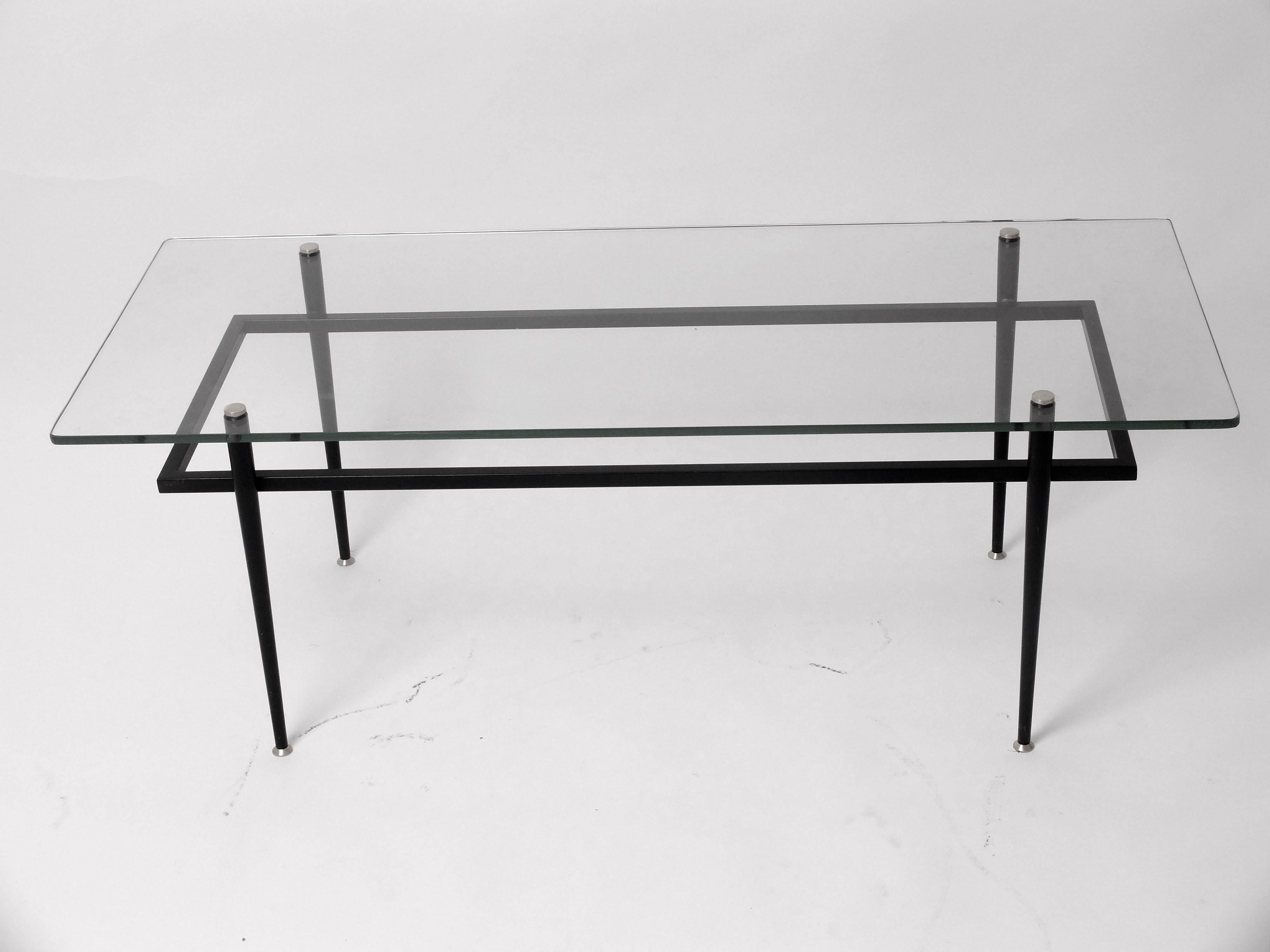 The Classic and only authentic Airborne coffee table from France,
circa 1960.
Black square tubular lacquered steel with original 10 mm glass and brass.
In perfect vintage condition.

Bibliographie: Madeleine Fuchs, 