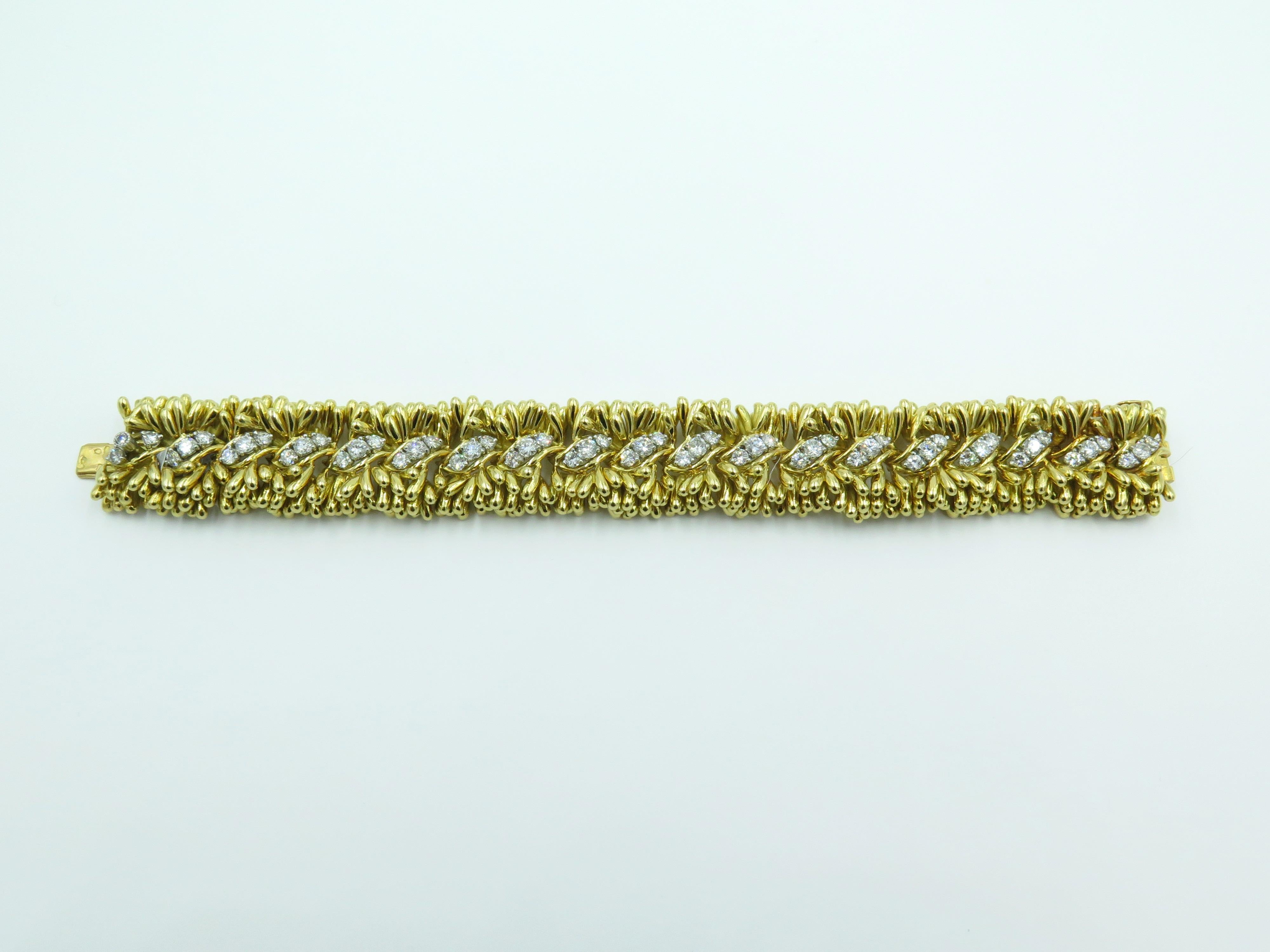 An 18 karat yellow gold and diamond bracelet. Roger Lucas. Circa 1960.  Stamped Lucas 18K, with French assay mark and maker’s mark. Designed as an articulated beaded band, enhanced by circular cut diamonds. Fifty seven (57) diamonds weigh