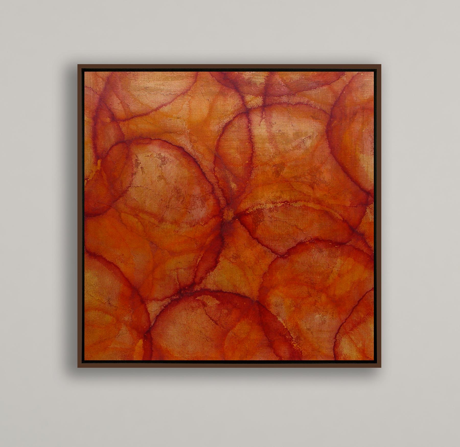 This abstract painting by Roger Mudre features a warm red and orange palette, with light, imperfect circle shapes layered over one another throughout the composition. The painting is made with acrylic paint over metal leaf on cradled panel. It is