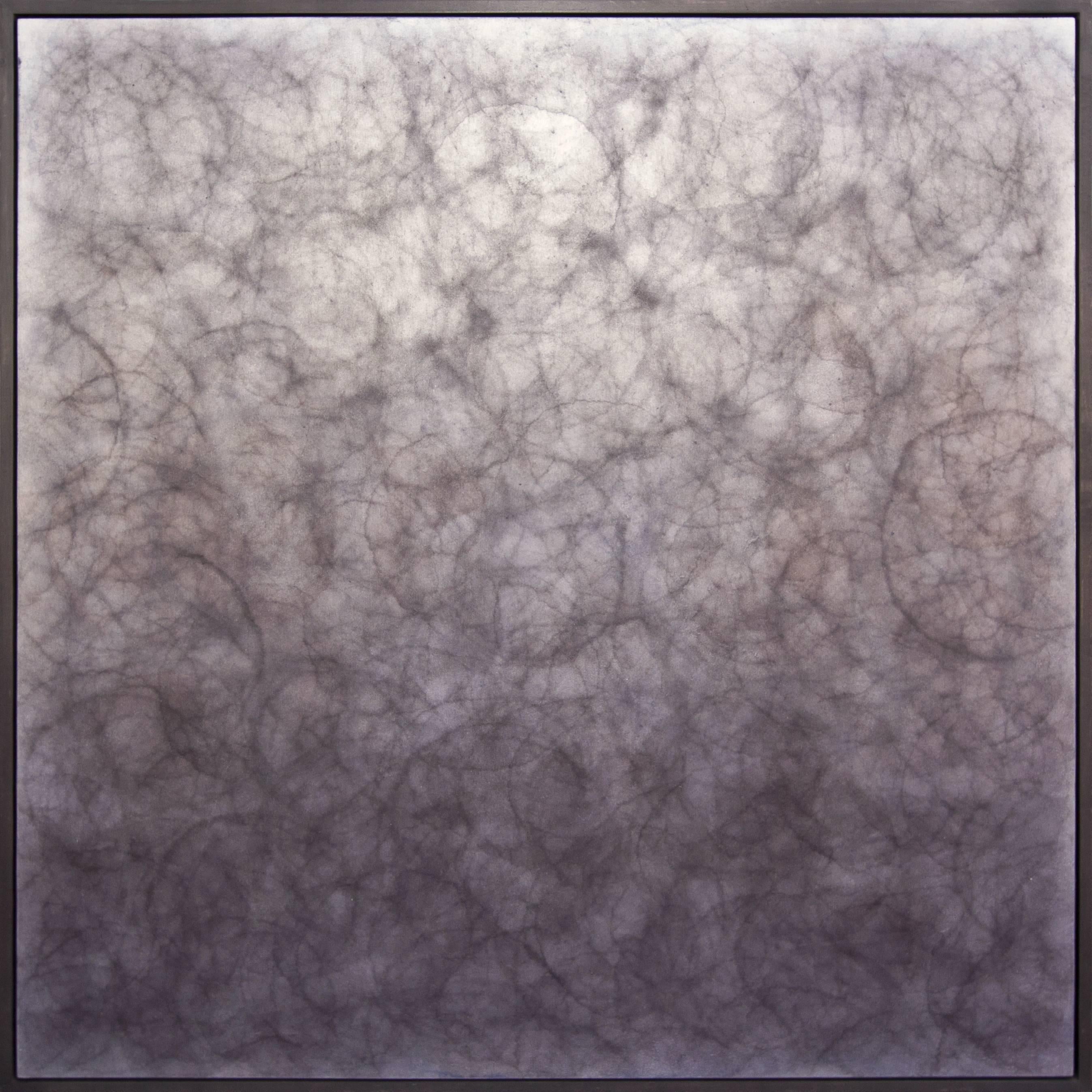 This abstract diptych painting by Roger Mudre features a charcoal grey palette, with light circles loosely overlapping one another across each panel. Each panel is professionally framed in dark pewter floater frames. The two panels are 41.5