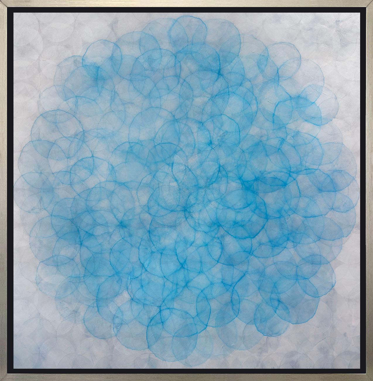 This abstract limited edition print by Roger Mudre features light circle shapes, layered over one another in a concentric fashion and a cool blue and silvery grey palette. This Limited Edition giclee print is an edition size of 25. Printed on