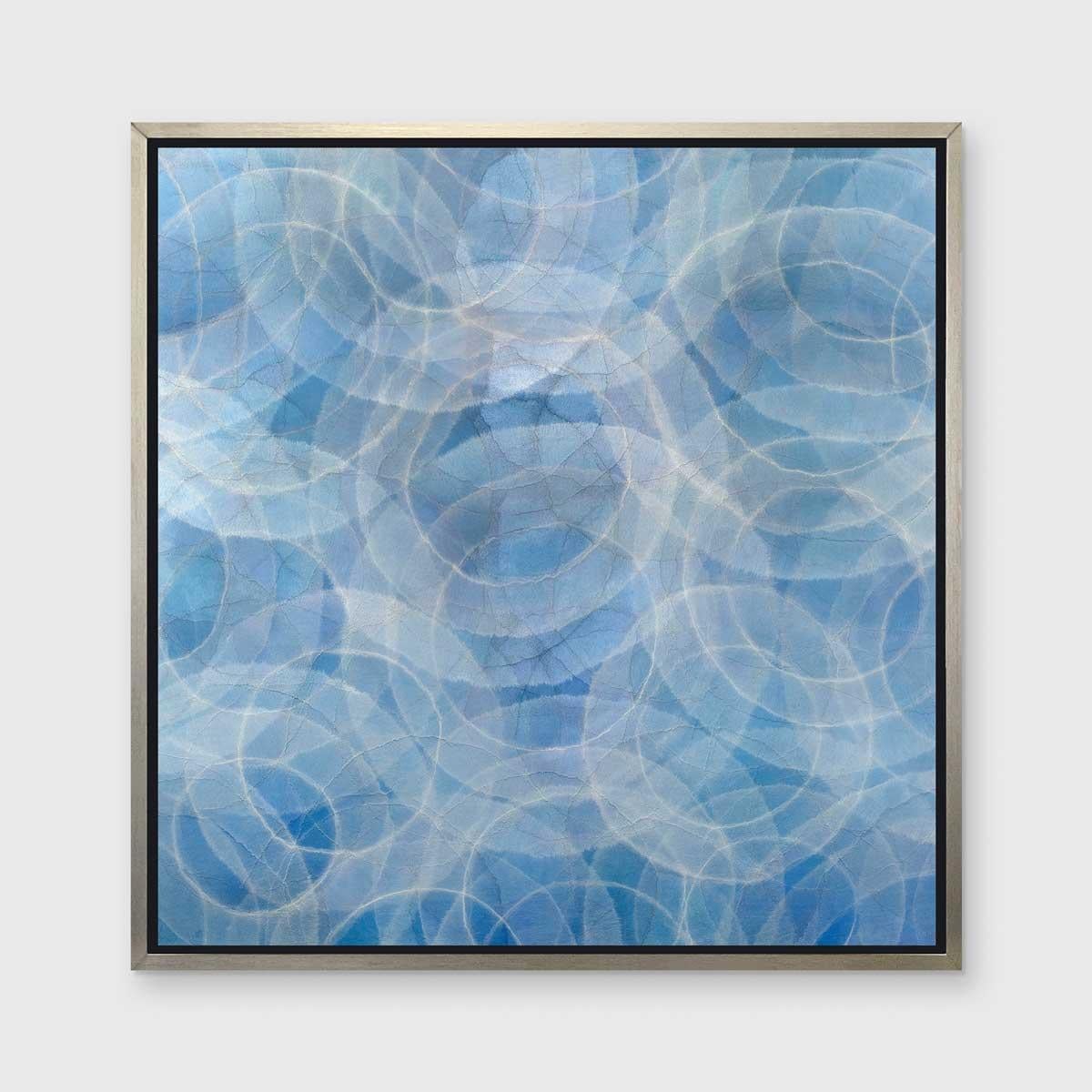 This abstract limited edition print by Roger Mudre features a light blue and silvery grey palette, with the light outlines of circles which almost appear to glow overlapping one another throughout the composition.

This Limited Edition giclee print